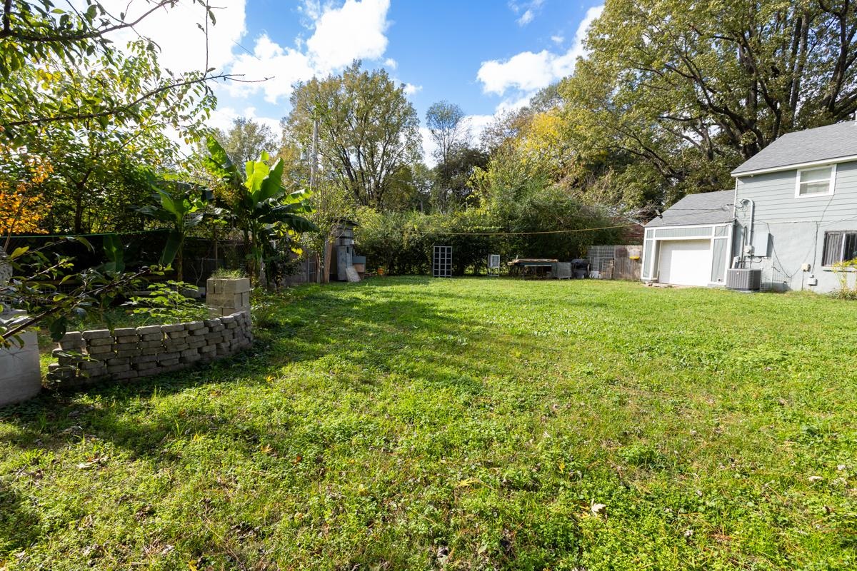 View of yard featuring cooling unit