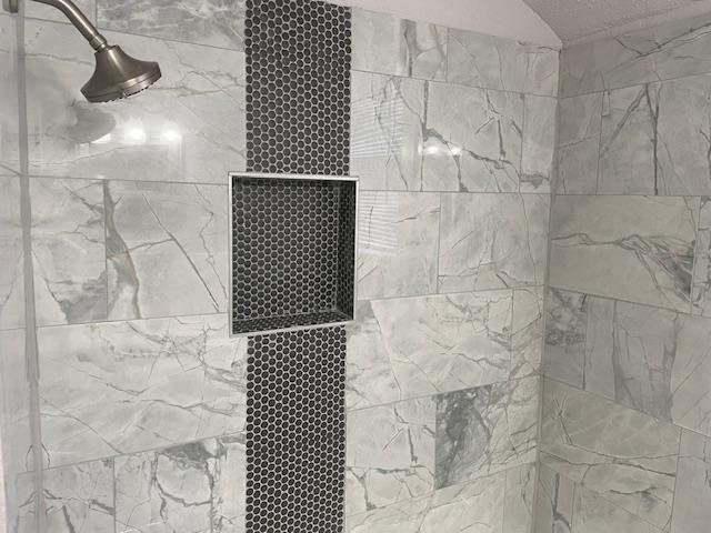 Details with a tile shower