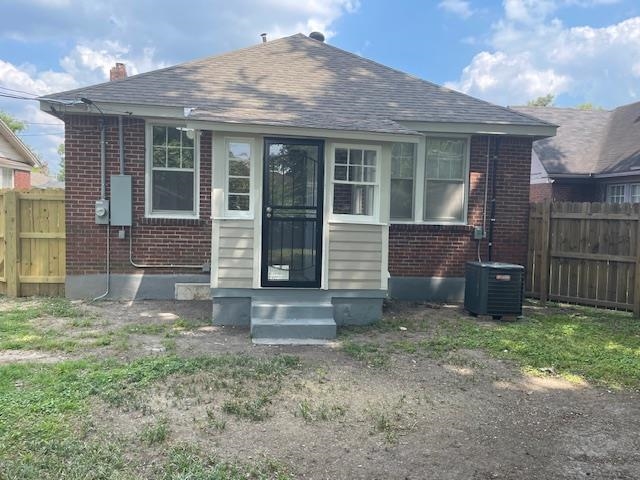 Rear view of house with central AC