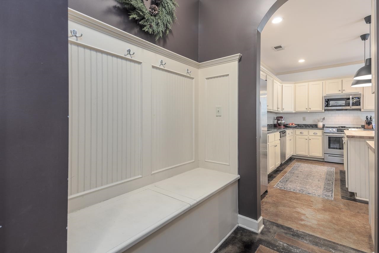 Mudroom featuring ornamental molding