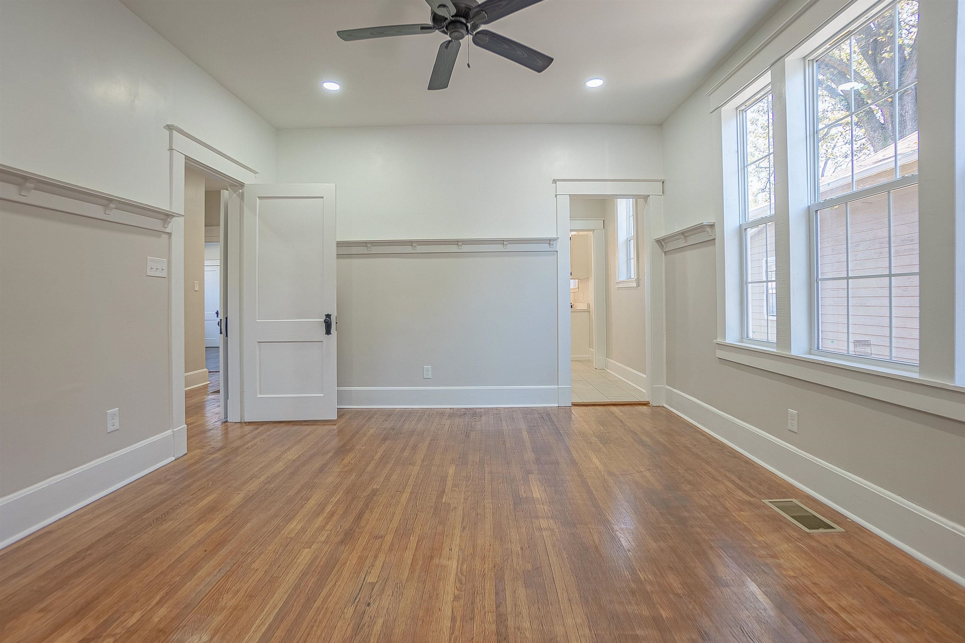 Unfurnished bedroom with a closet, ceiling fan, and hardwood / wood-style floors
