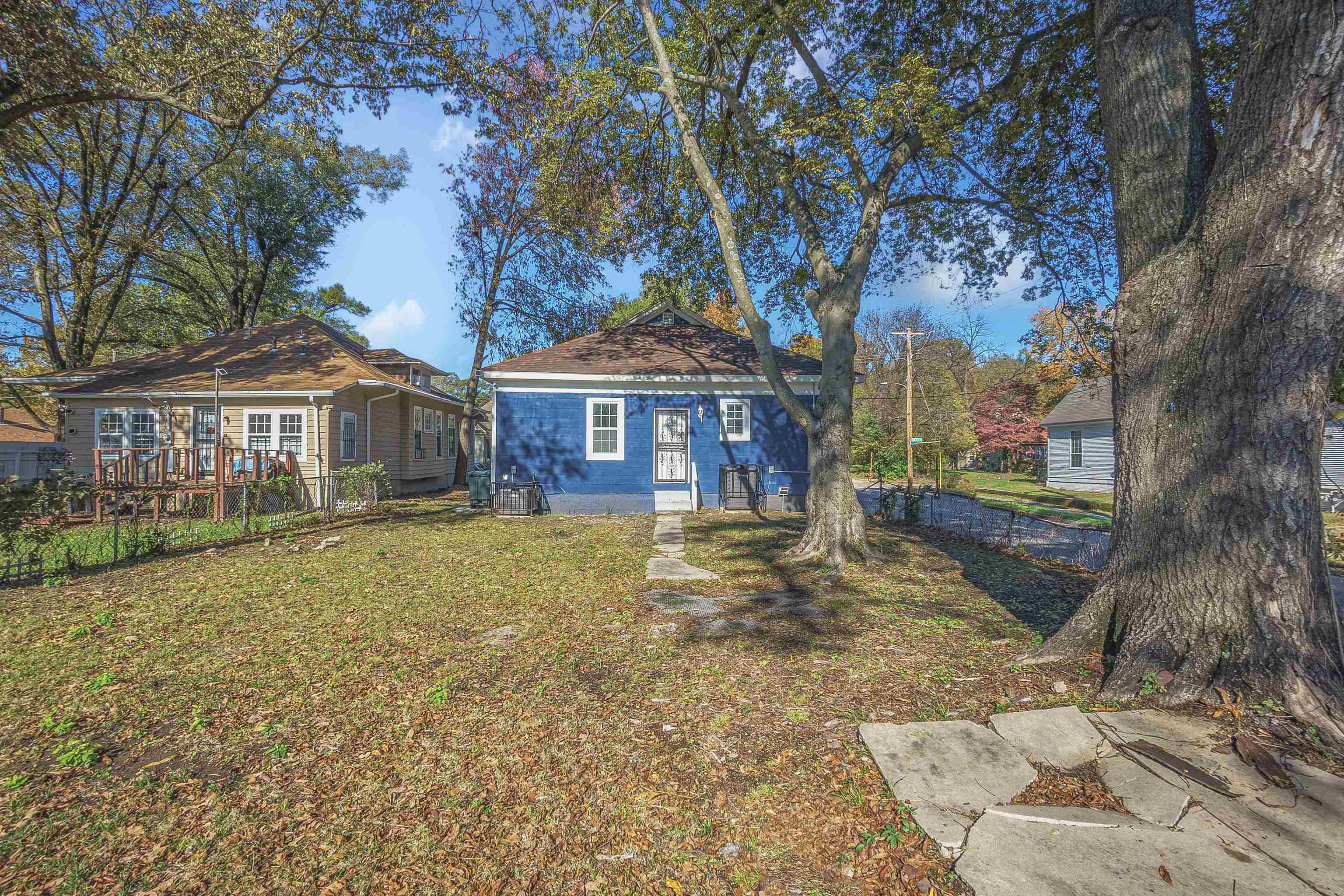Rear view of house with a yard