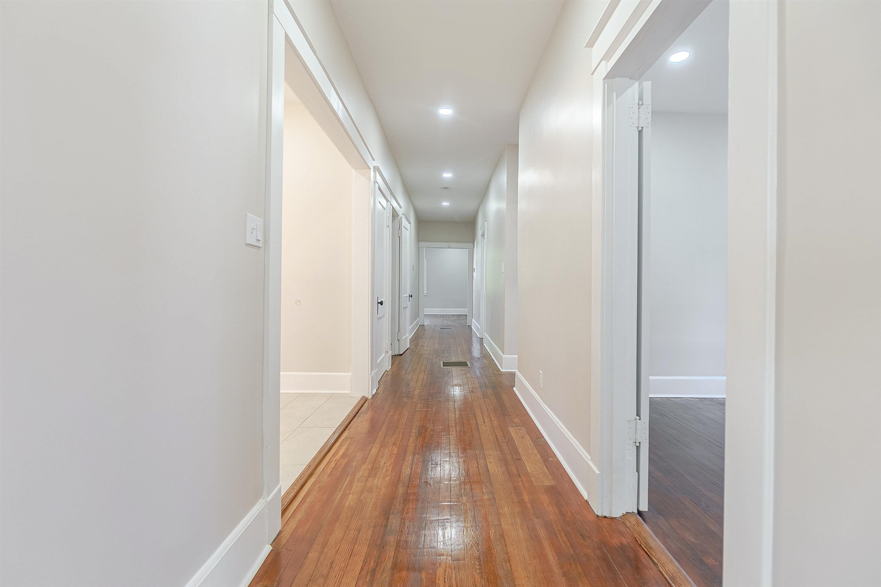 Hallway with wood-type flooring
