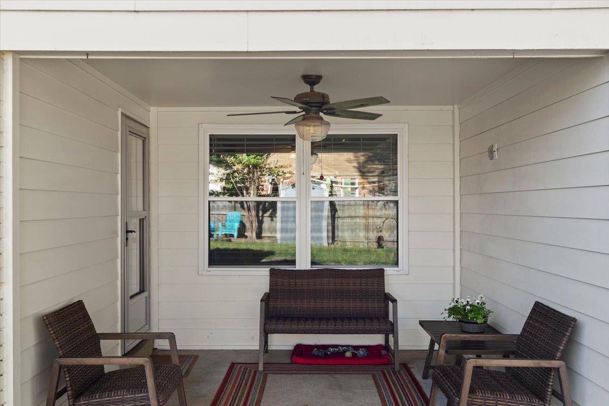 View of patio featuring ceiling fan