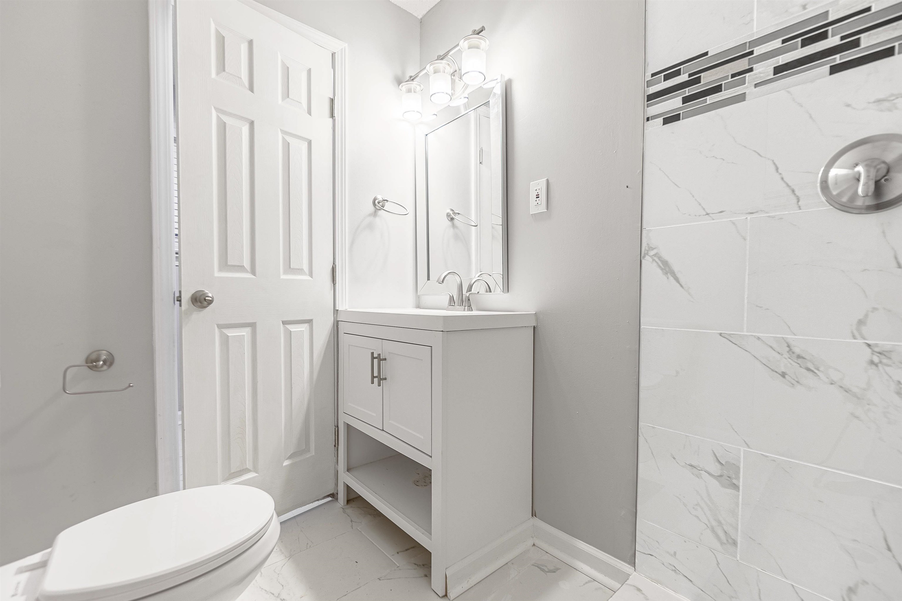 Bathroom with vanity and toilet