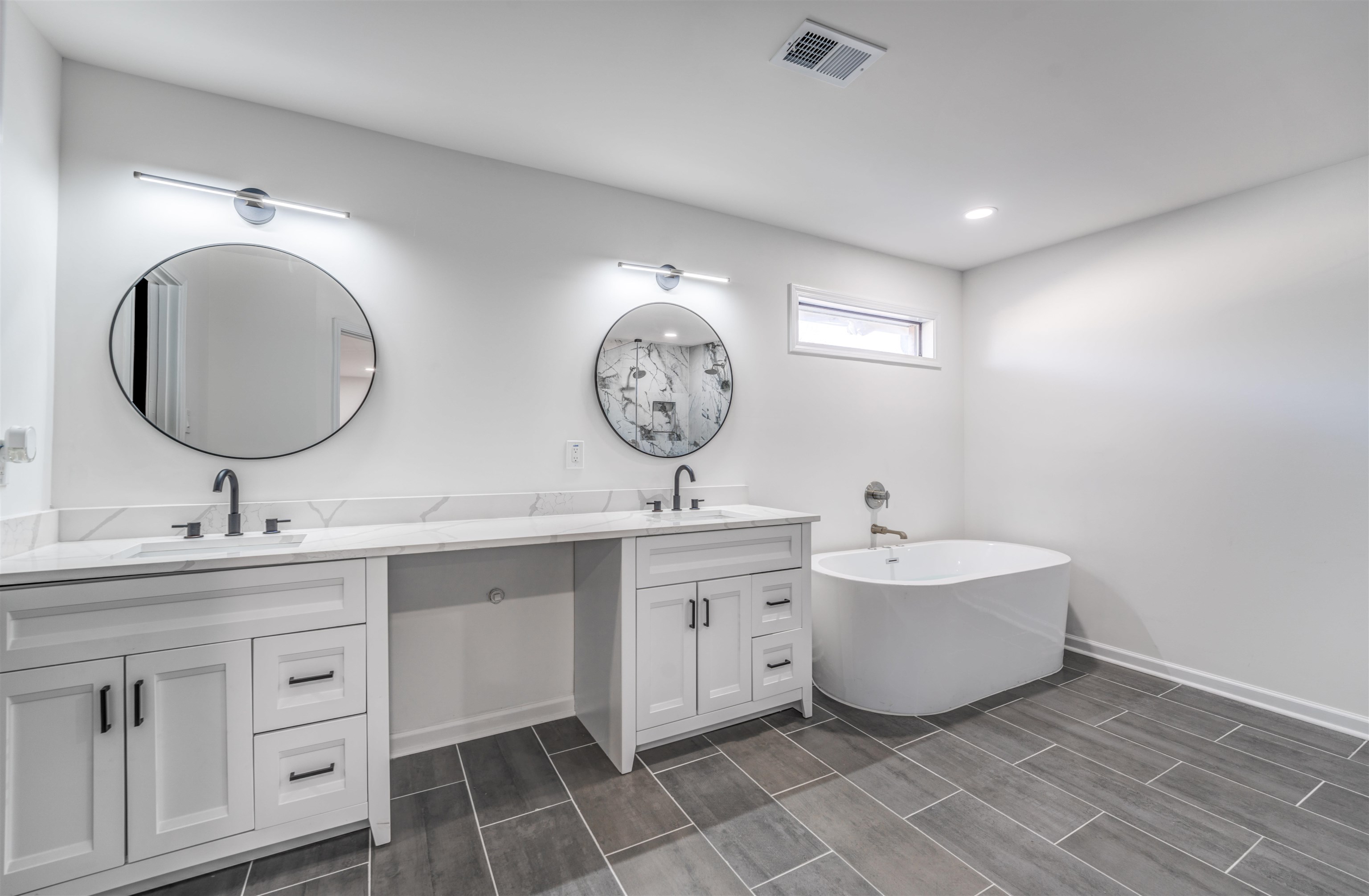 Bathroom featuring a bathtub and vanity