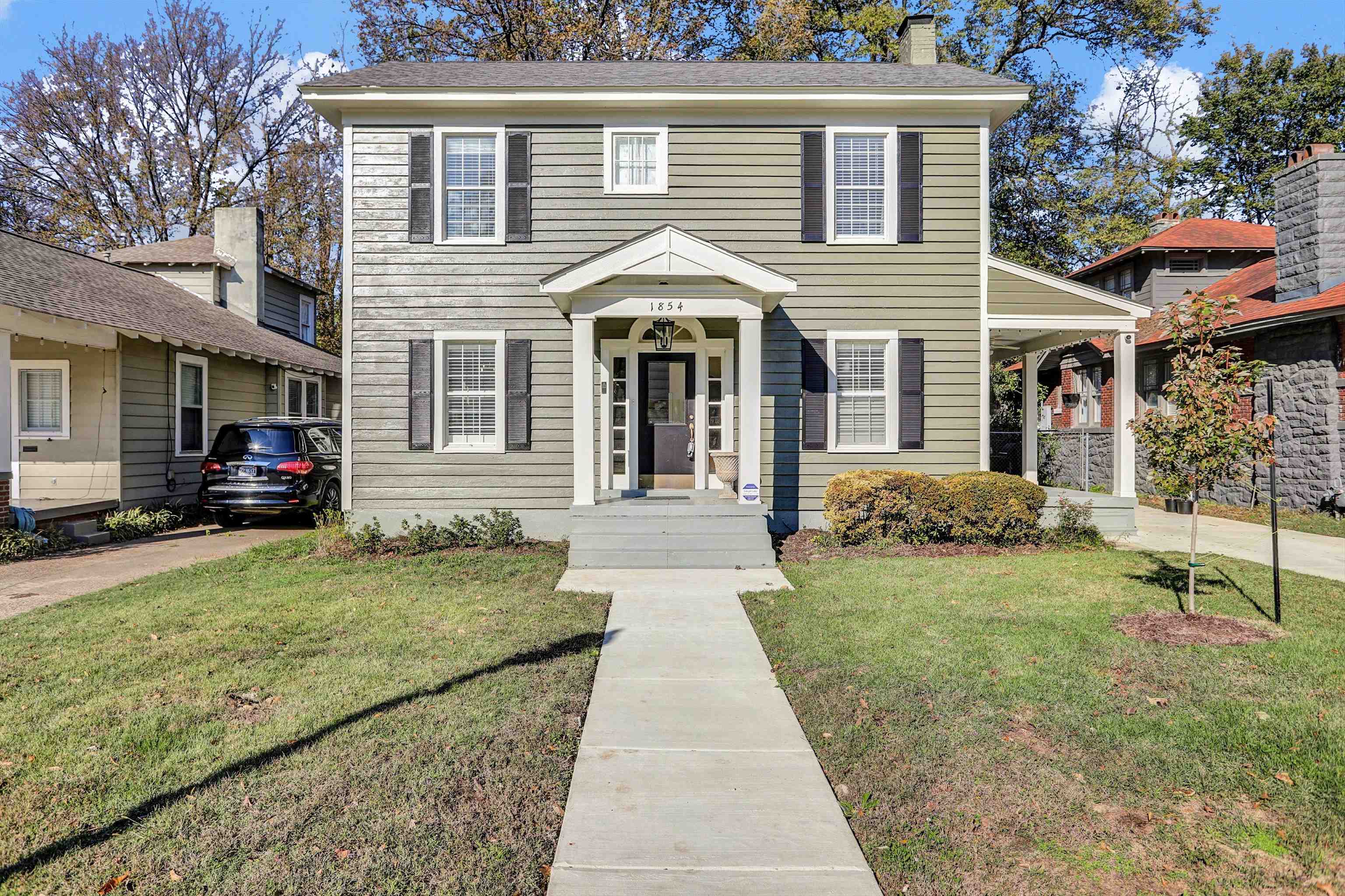 Colonial inspired home with a front yard