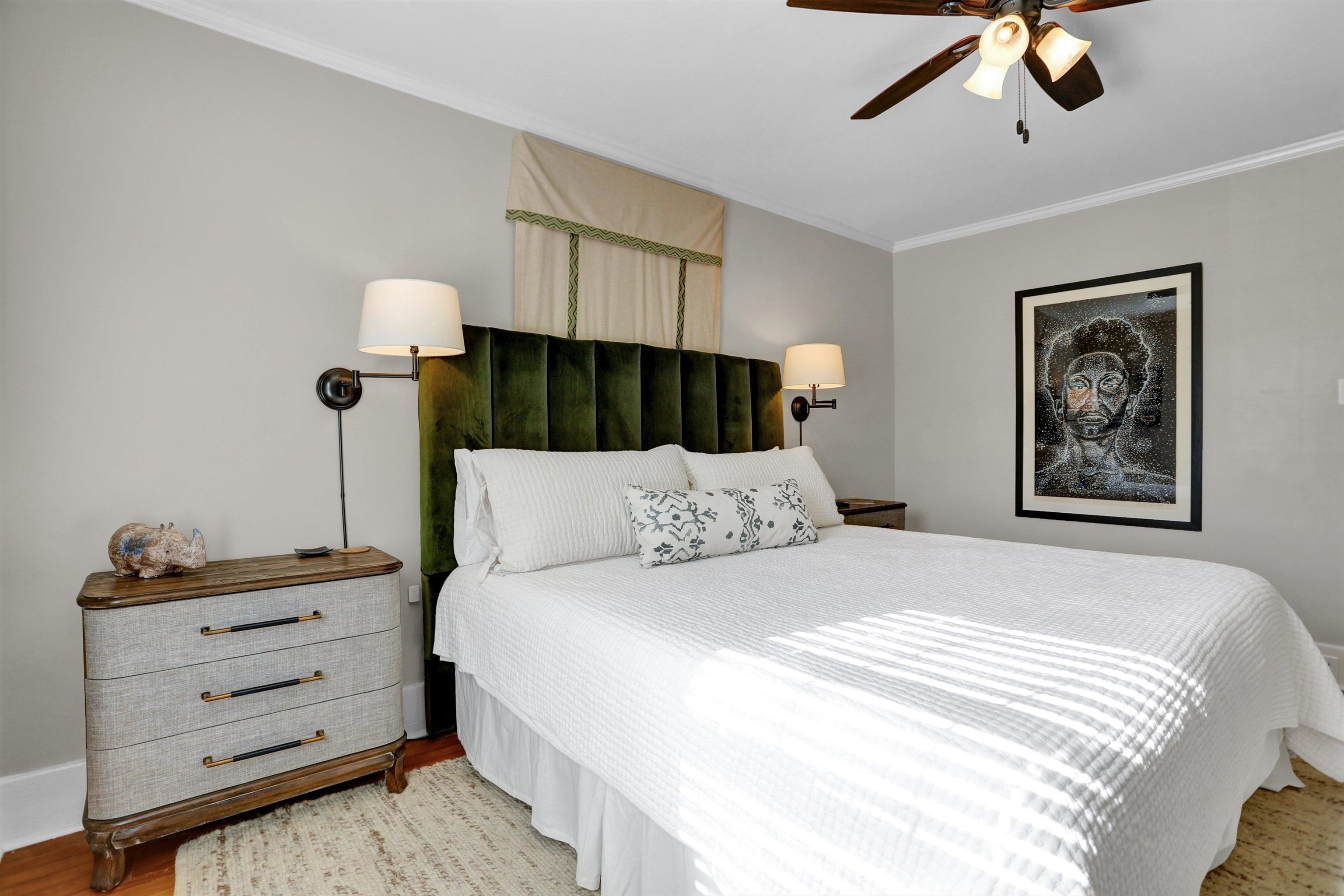 Bedroom with ceiling fan, light hardwood / wood-style floors, and ornamental molding