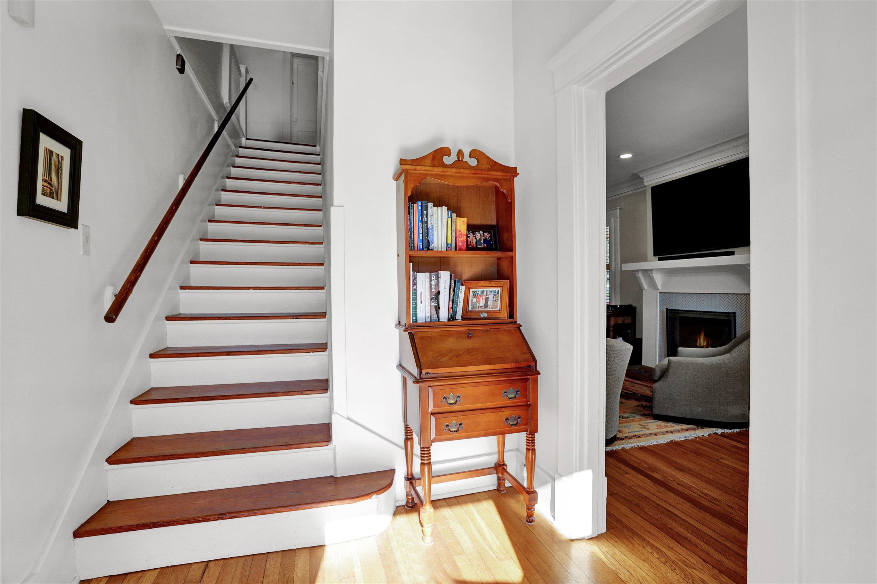 Stairway with hardwood / wood-style floors