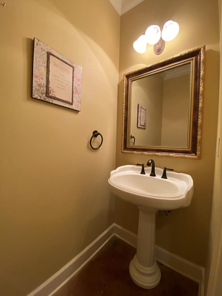 Bathroom featuring crown molding