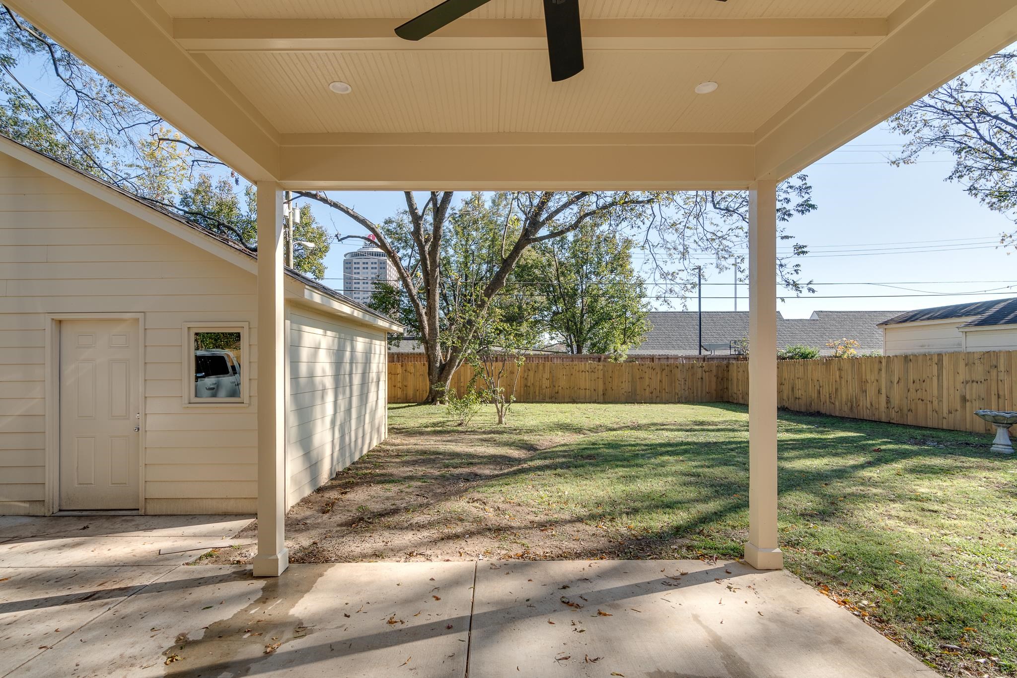 View of yard with ceiling fan and a patio area