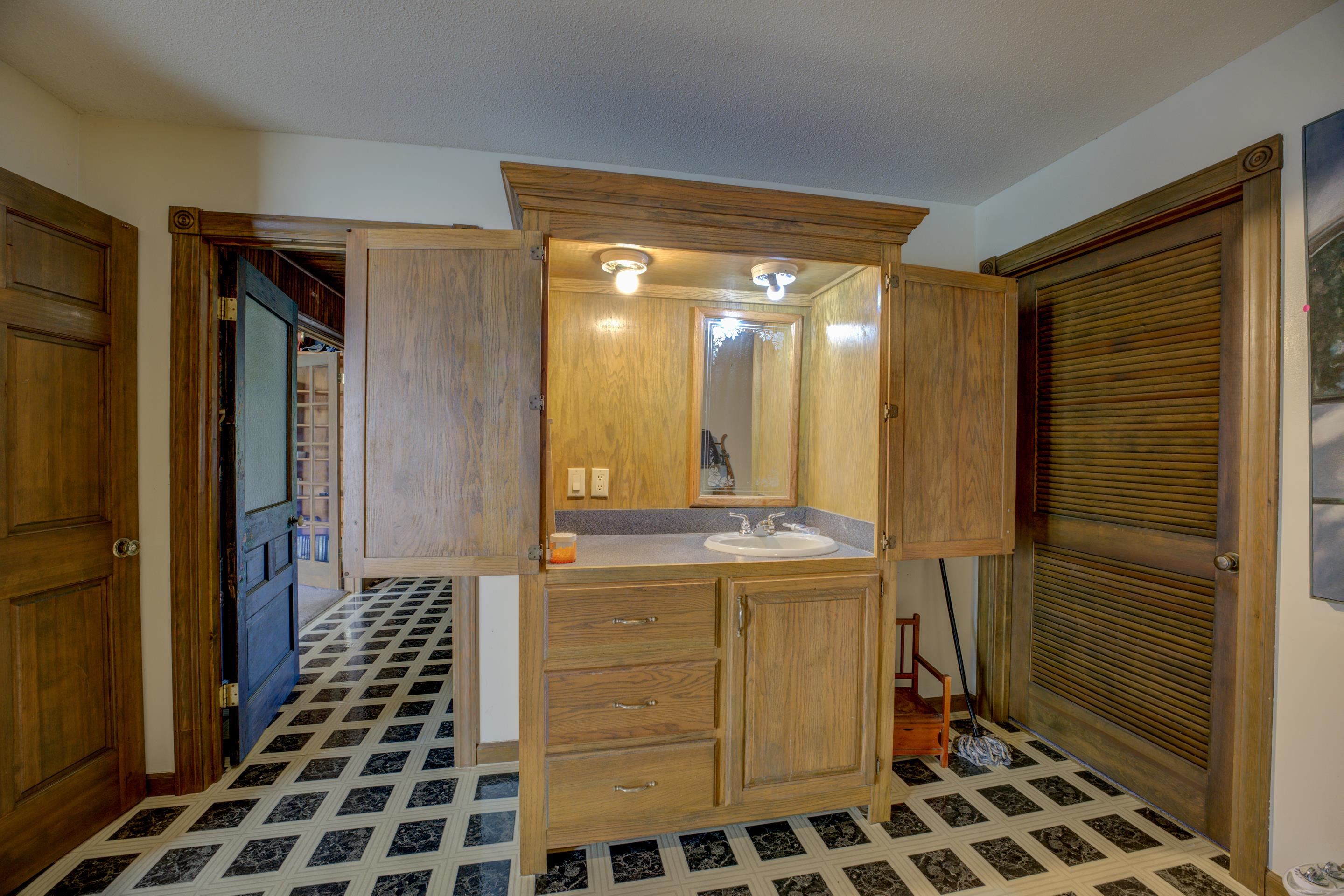 Bathroom featuring vanity and a textured ceiling