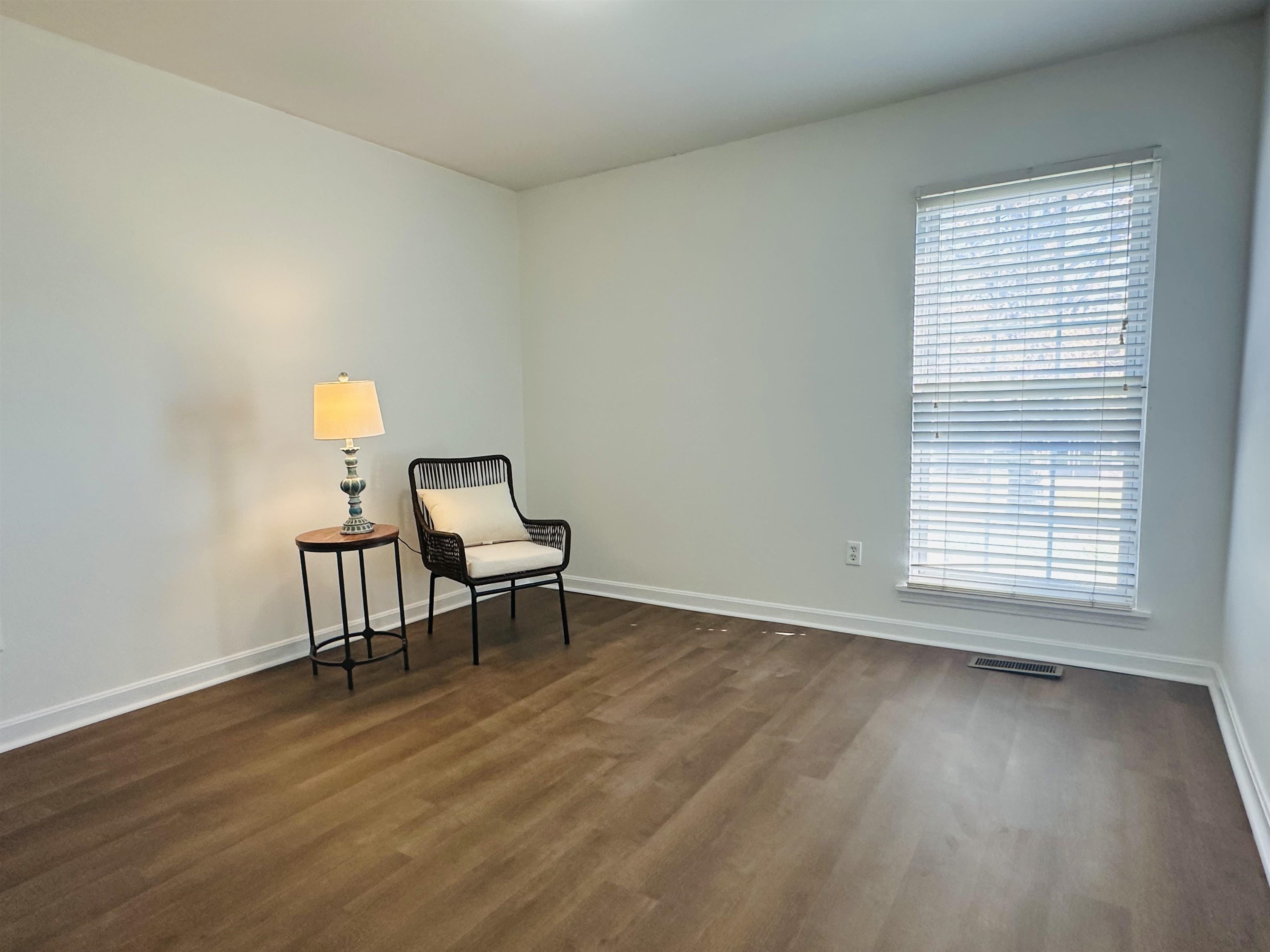 Living area featuring dark wood-type flooring