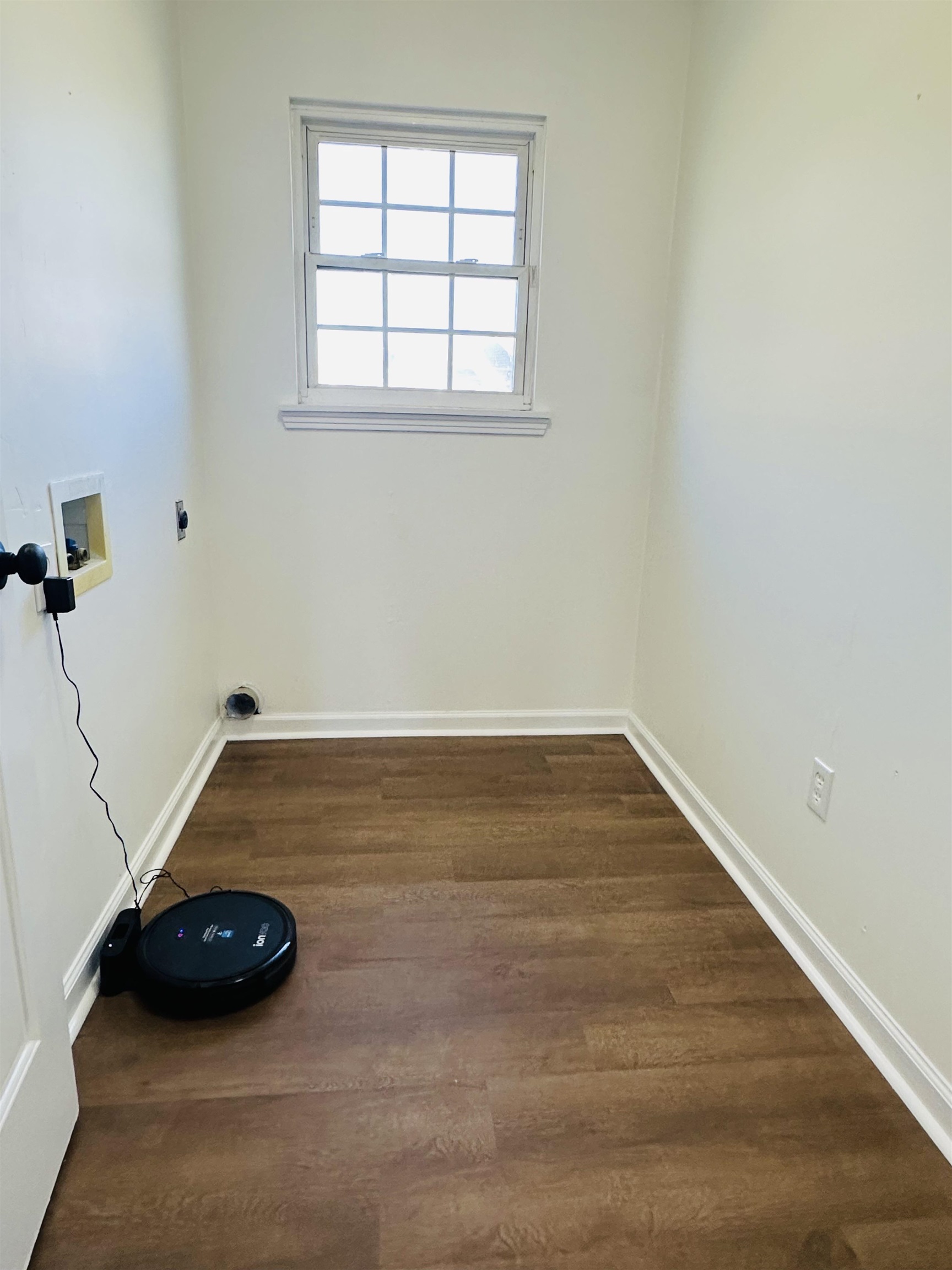 Laundry room featuring hookup for an electric dryer, dark wood-type flooring, and hookup for a washing machine