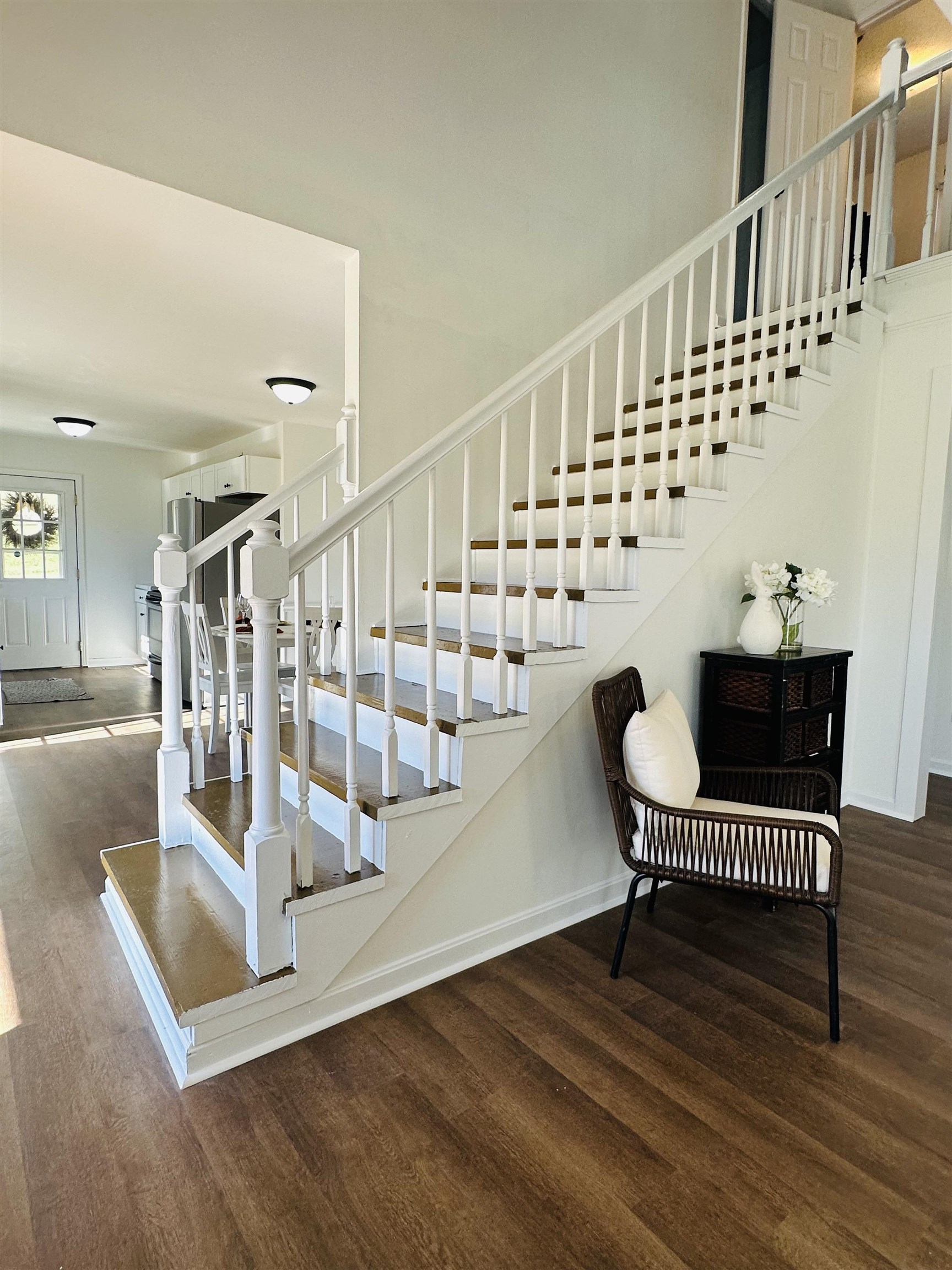 Stairway with hardwood / wood-style flooring