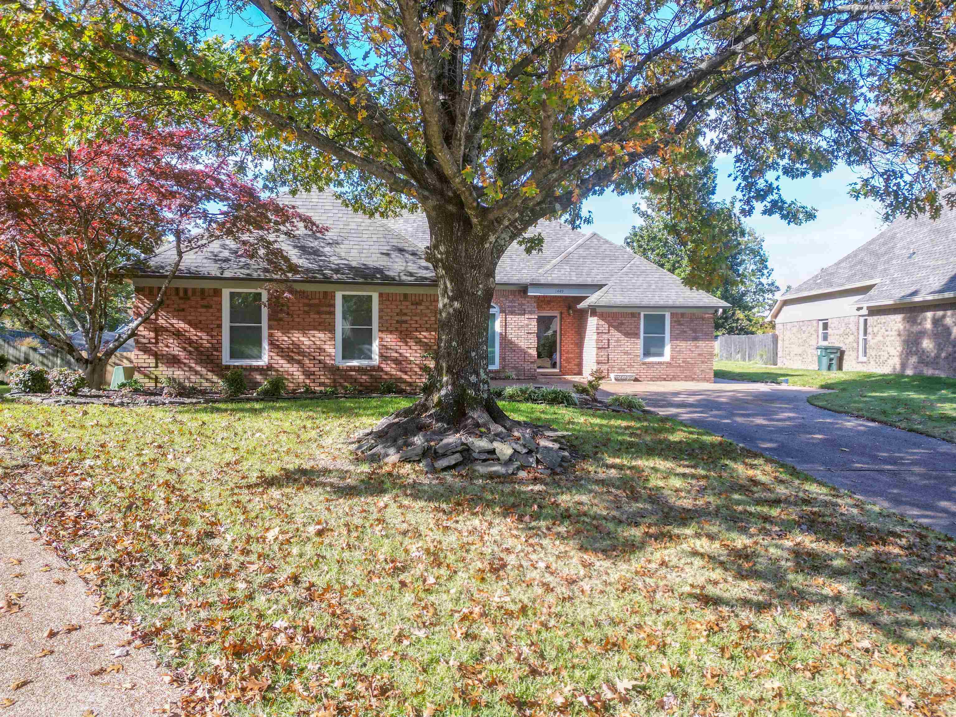 Ranch-style home with a front lawn