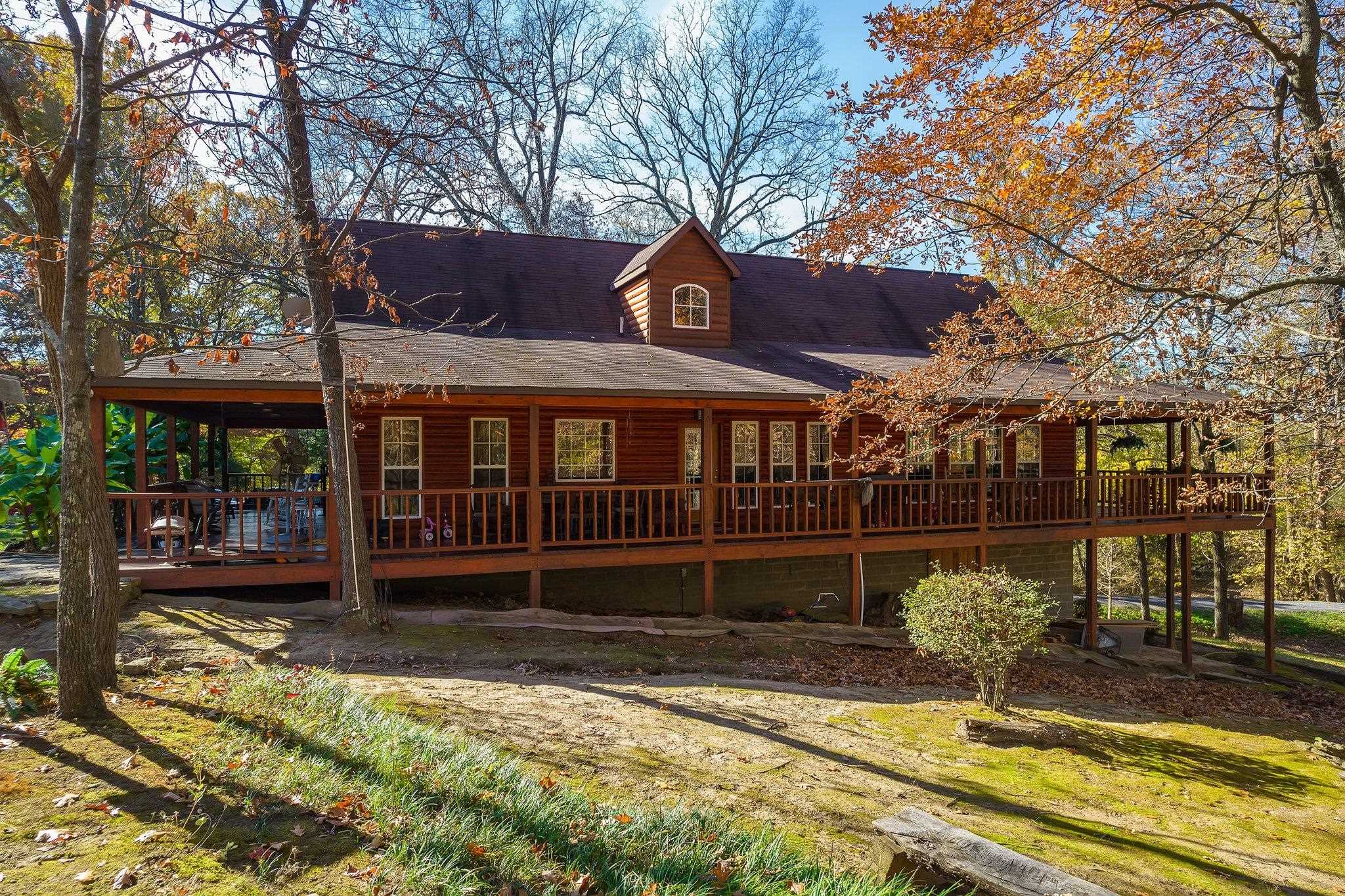 Rear view of house with a deck