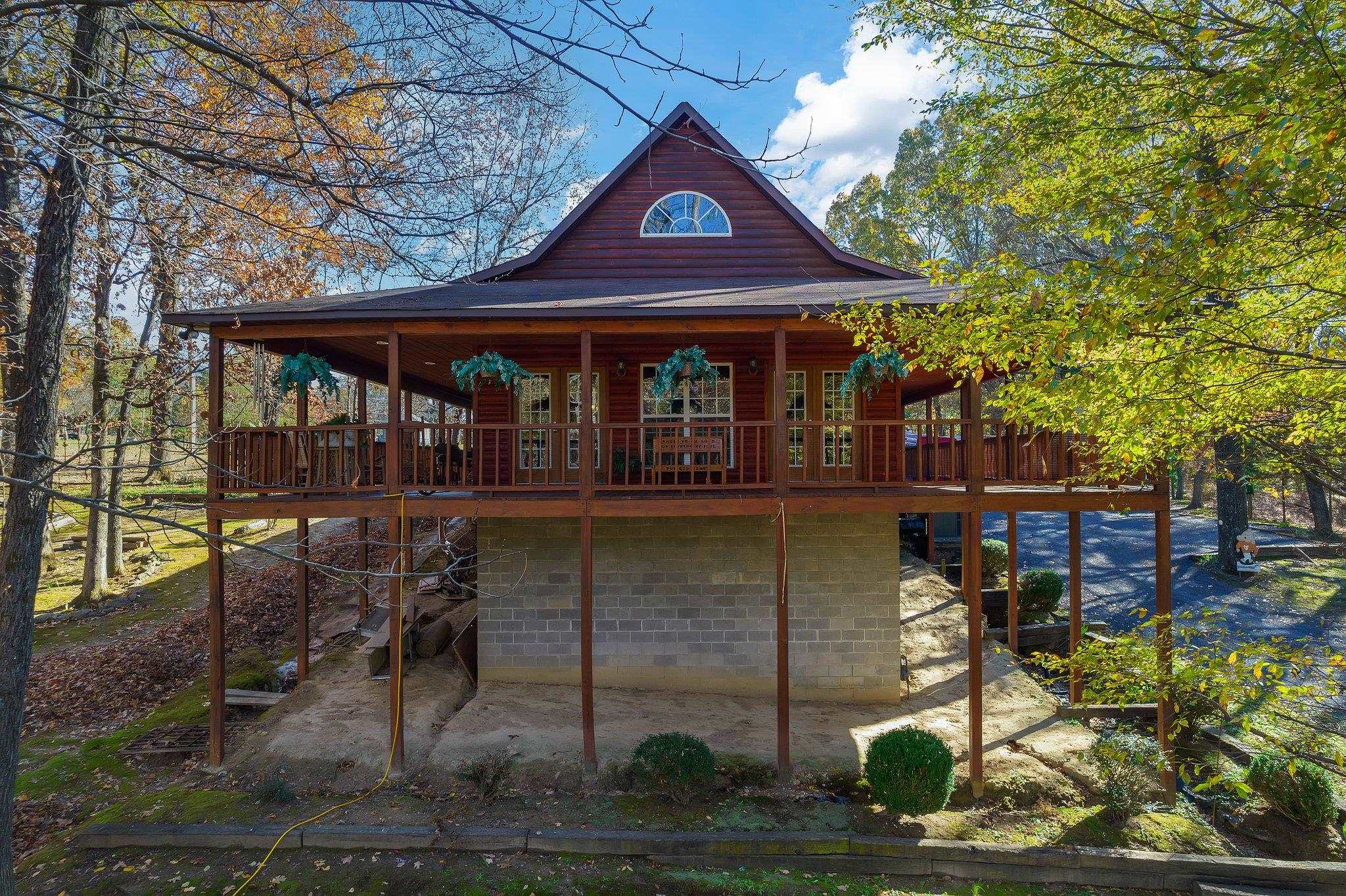Back of property featuring a wooden deck