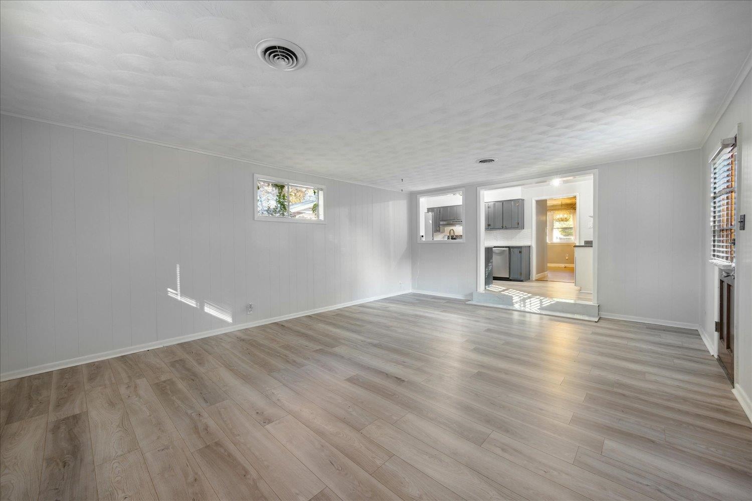 Unfurnished living room with light hardwood / wood-style flooring