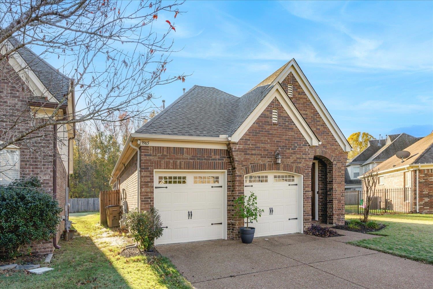 View of front of house featuring a front yard and a garage