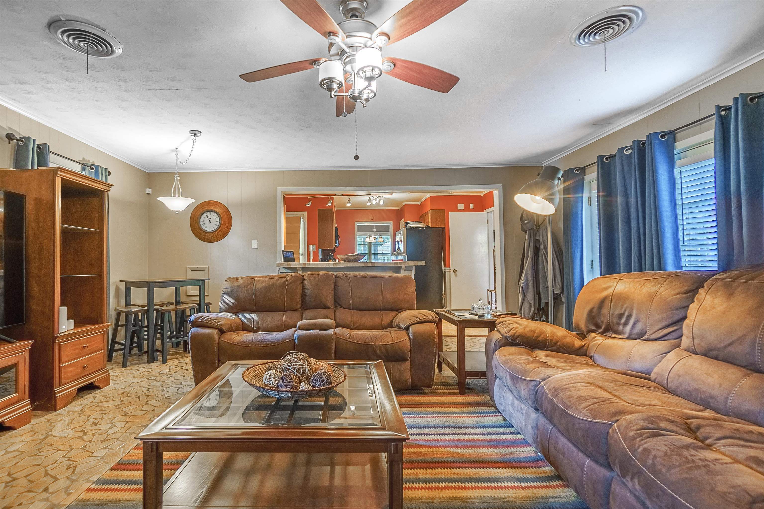 Living room featuring ceiling fan