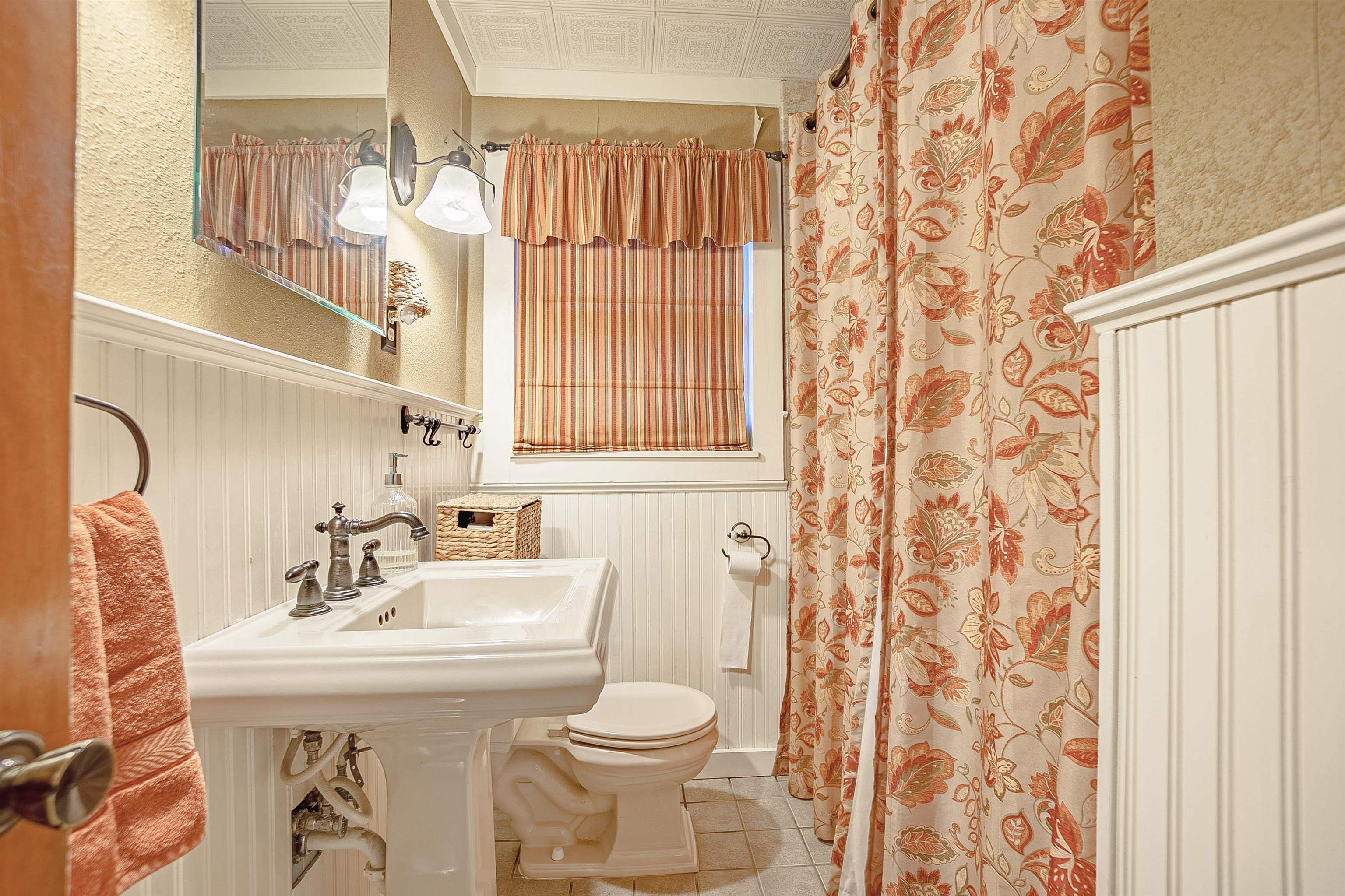 Bathroom featuring sink, tile patterned flooring, and toilet