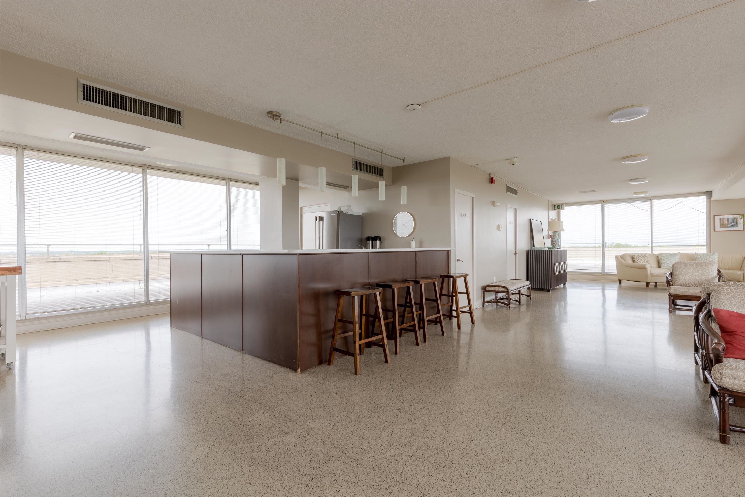 Kitchen with stainless steel fridge and a breakfast bar area