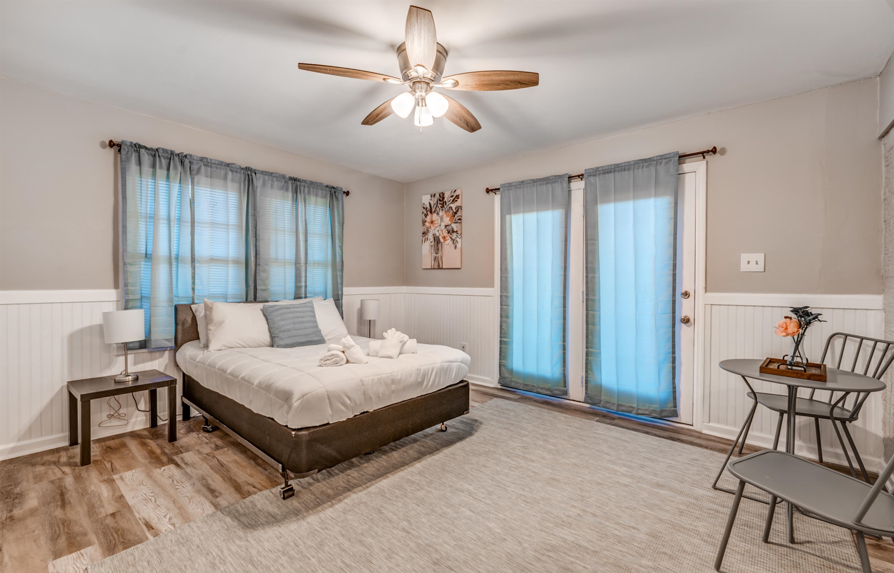 Bedroom with ceiling fan and light hardwood / wood-style flooring