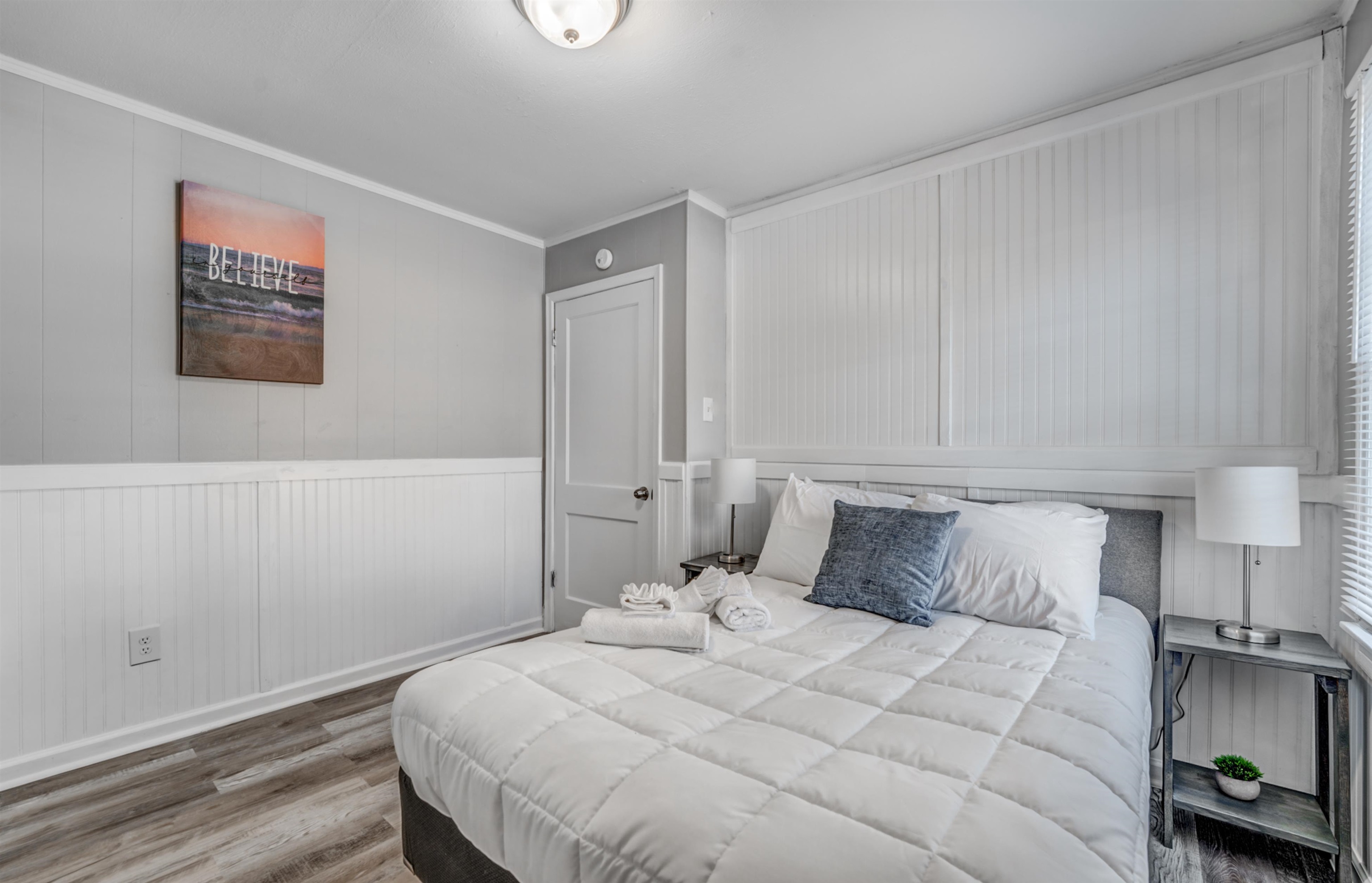 Bedroom featuring crown molding and hardwood / wood-style flooring