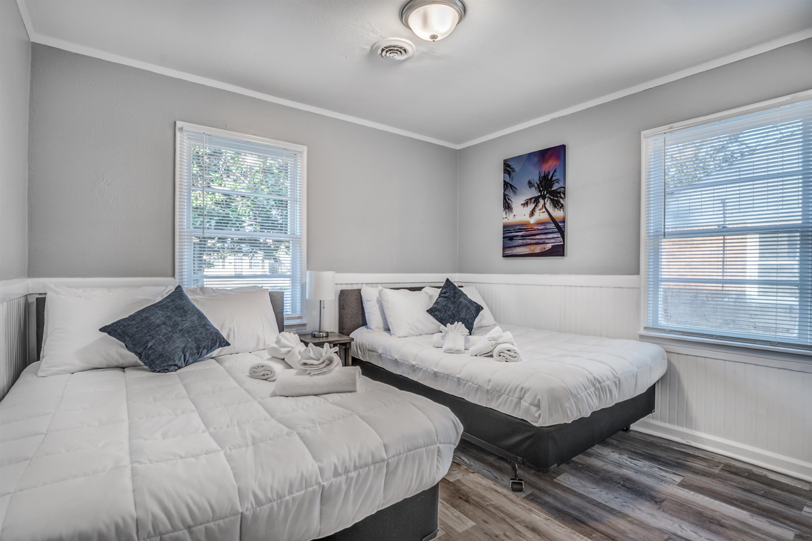 Bedroom featuring hardwood / wood-style flooring and crown molding