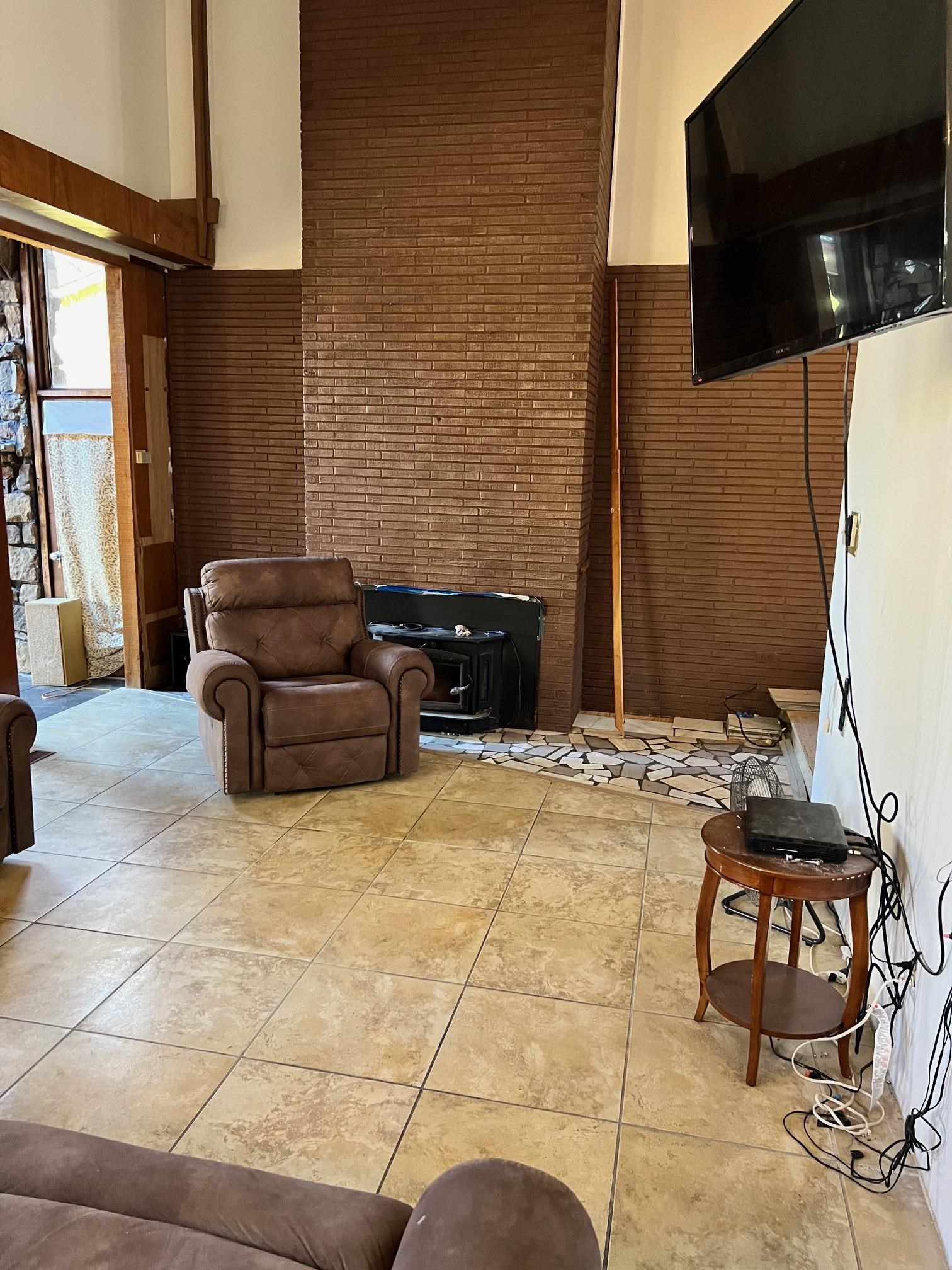 Living room with brick wall