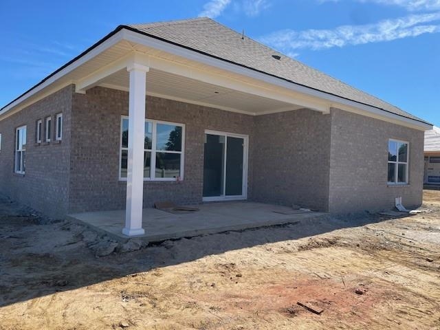 Rear view of house with a patio area