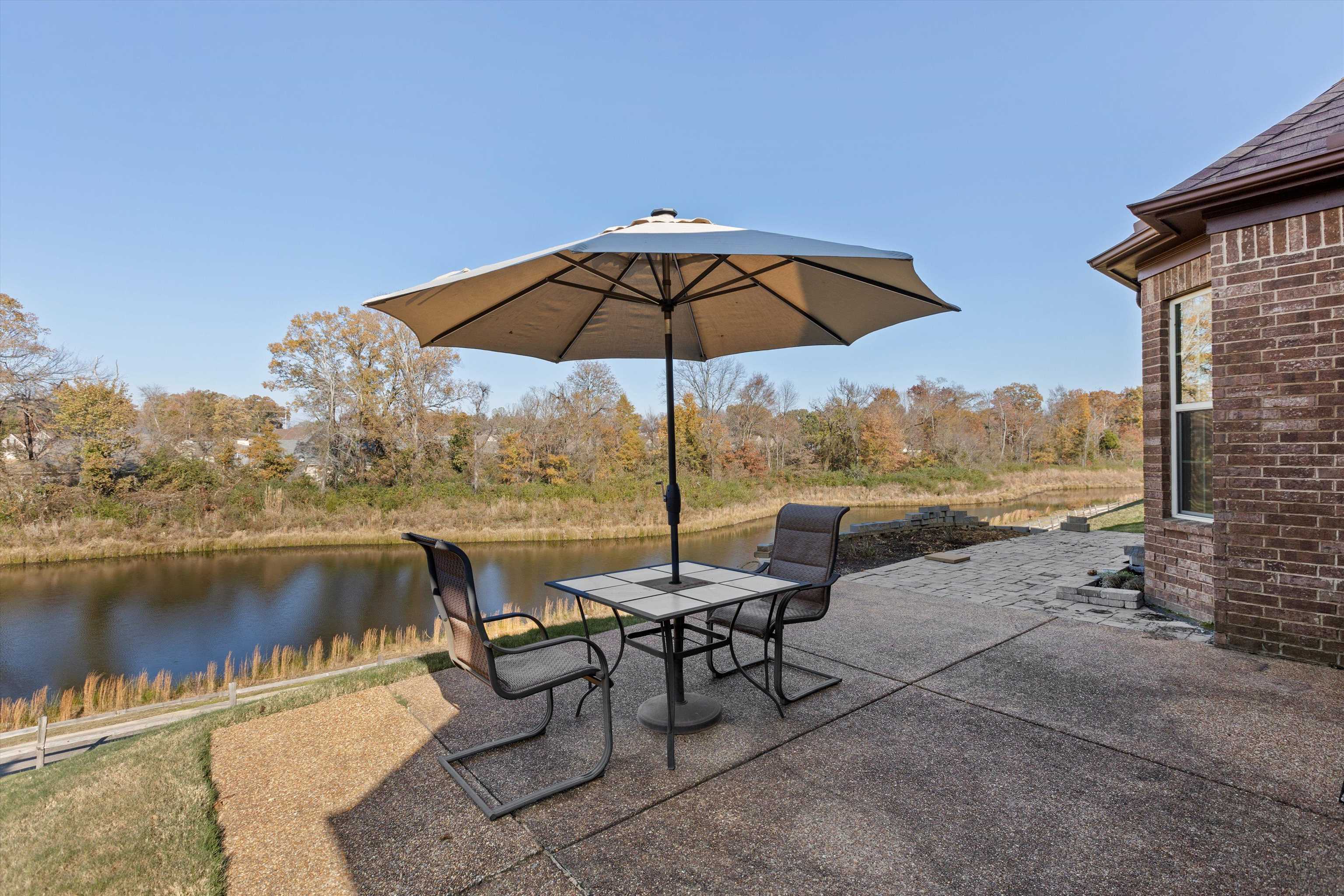 View of patio / terrace featuring a water view