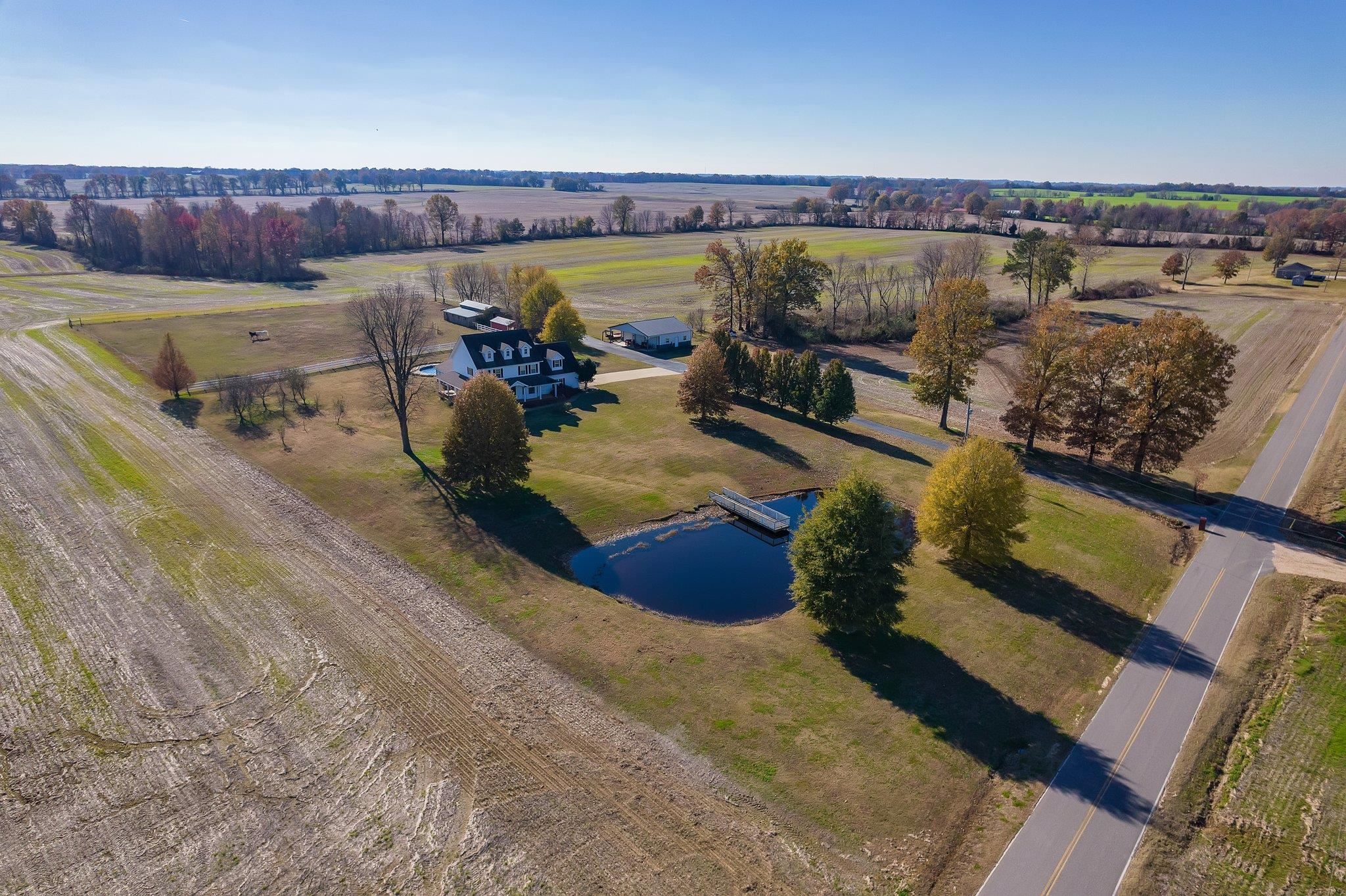 Drone / aerial view with a water view and a rural view