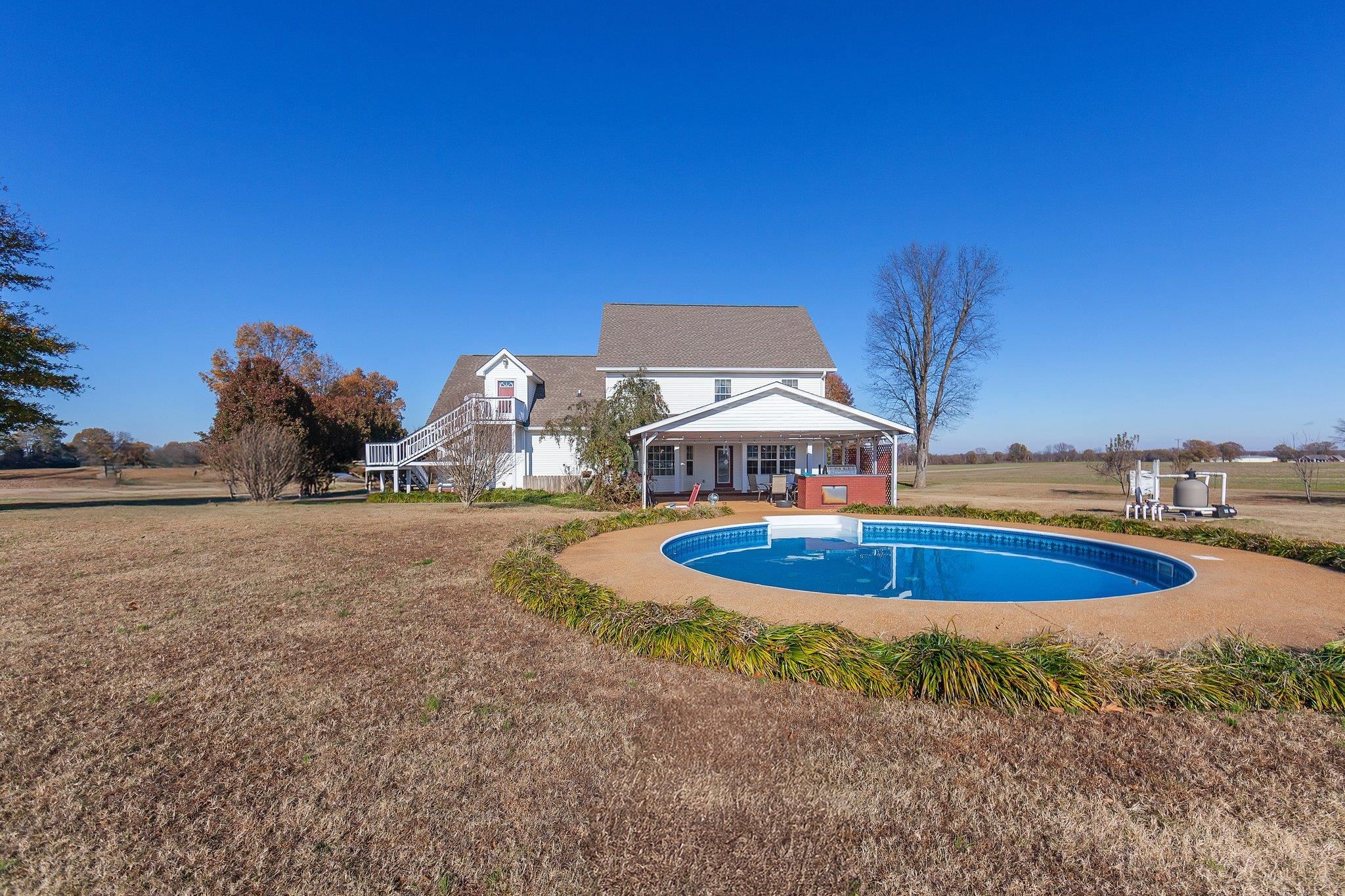 View of swimming pool with a lawn and a patio area