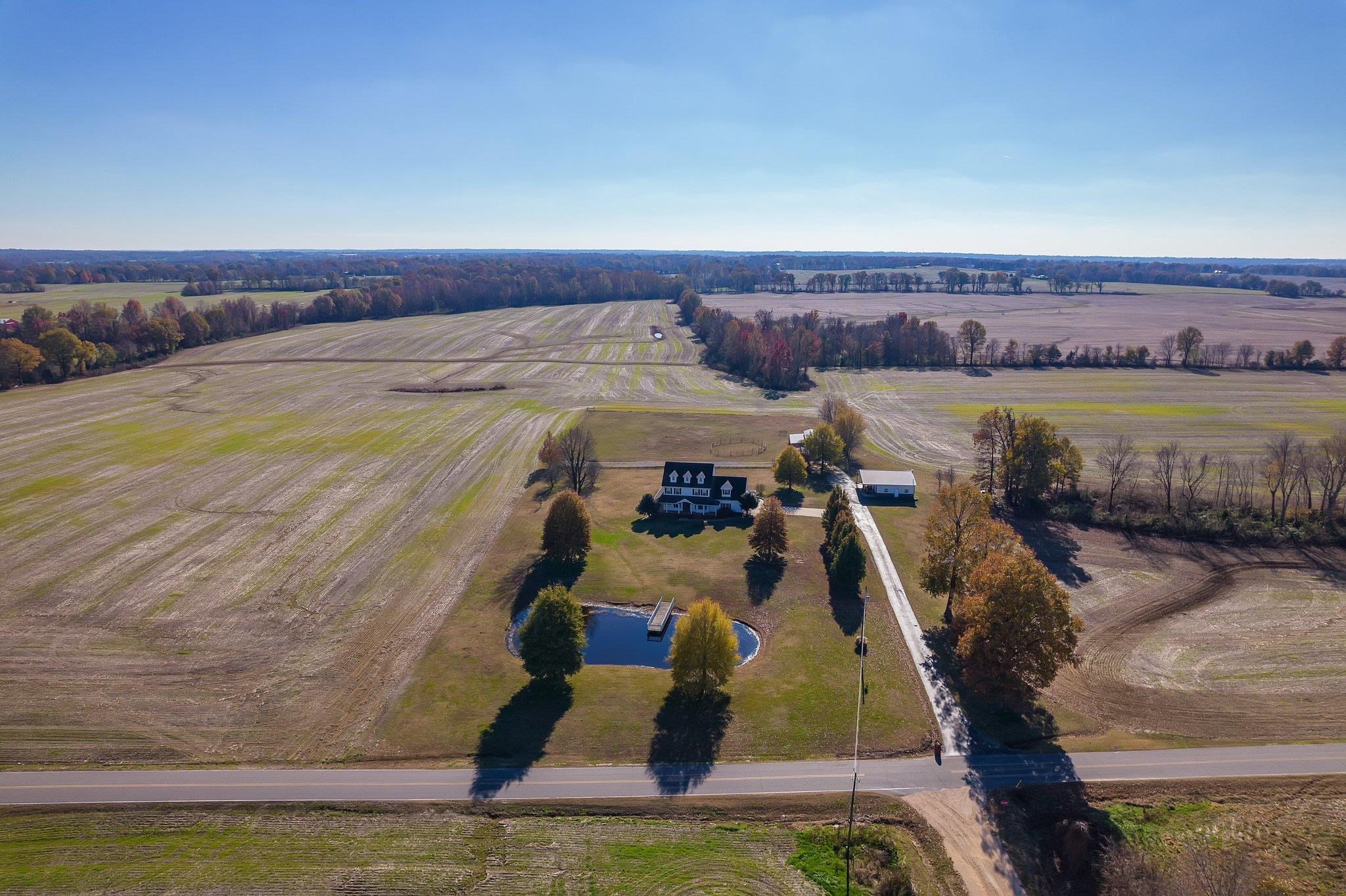 Birds eye view of property with a rural view