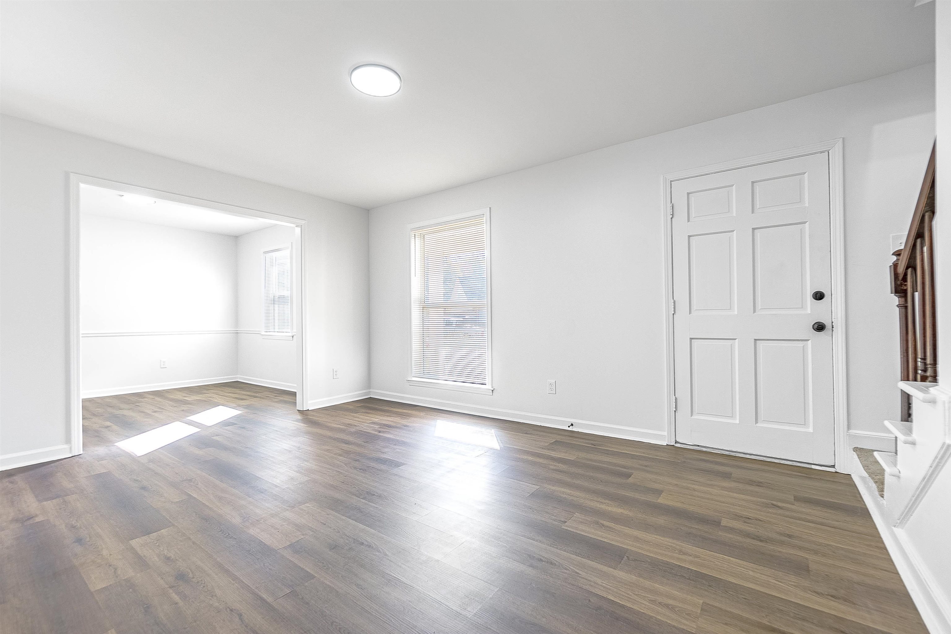 Spare room with dark wood-type flooring