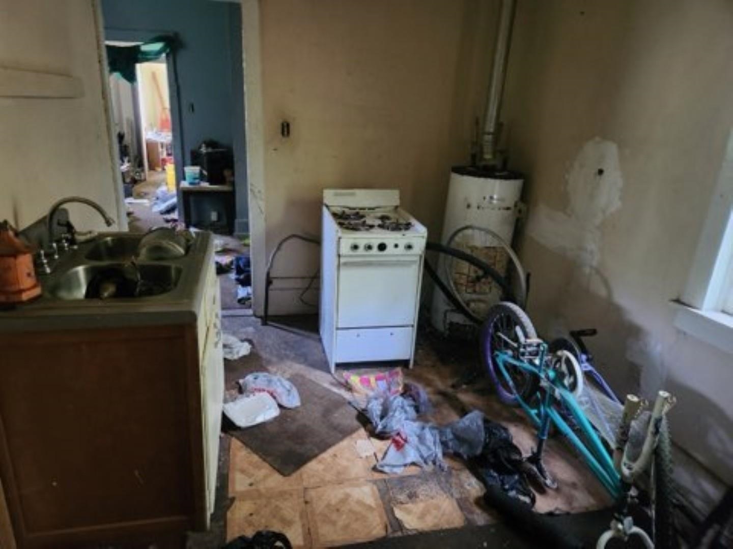 Interior space featuring sink and water heater