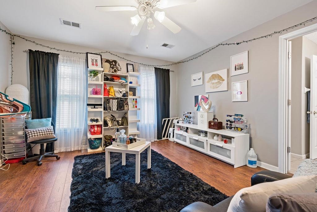 Playroom featuring ceiling fan and wood-type flooring