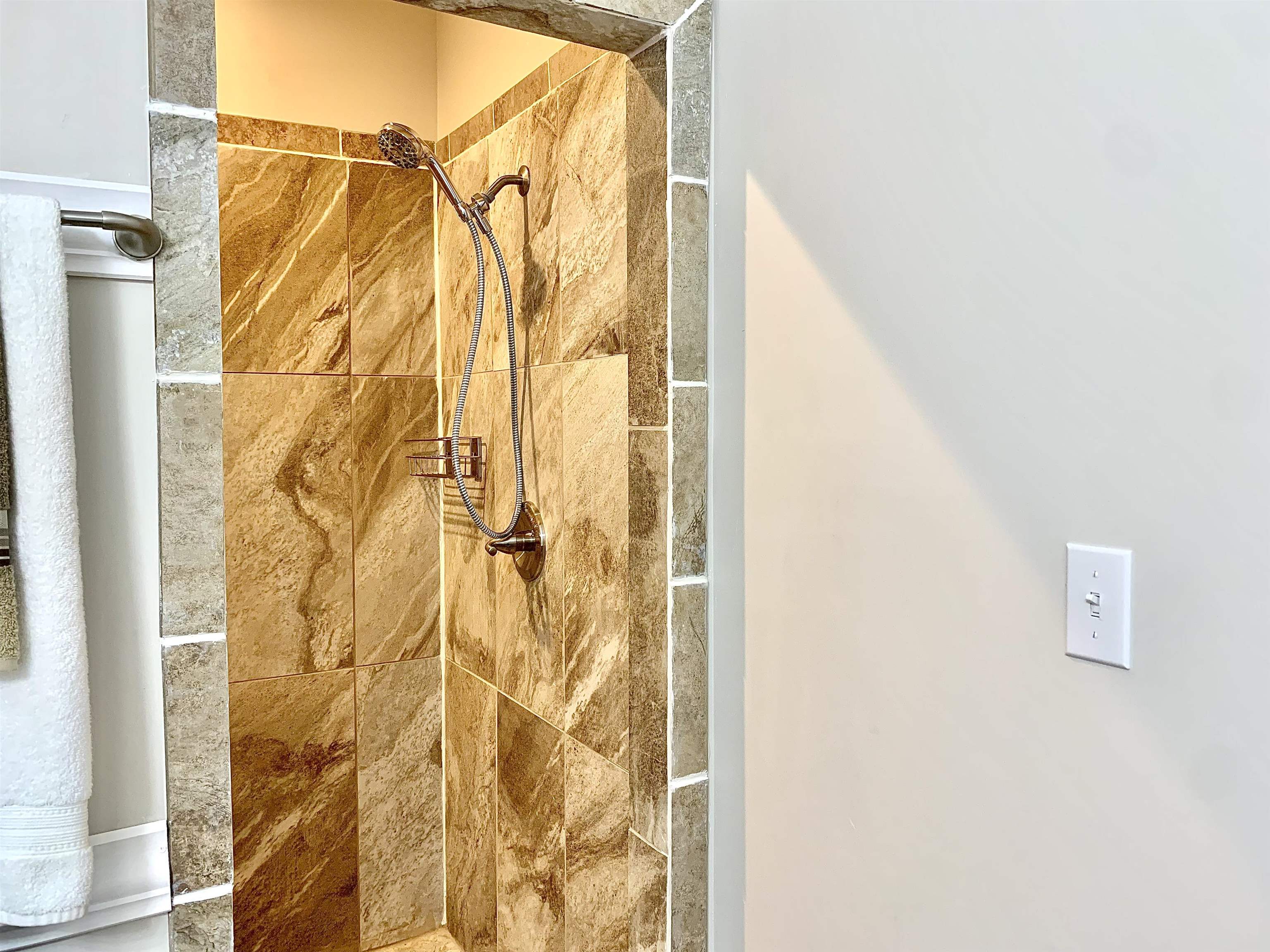 Bathroom with tiled shower