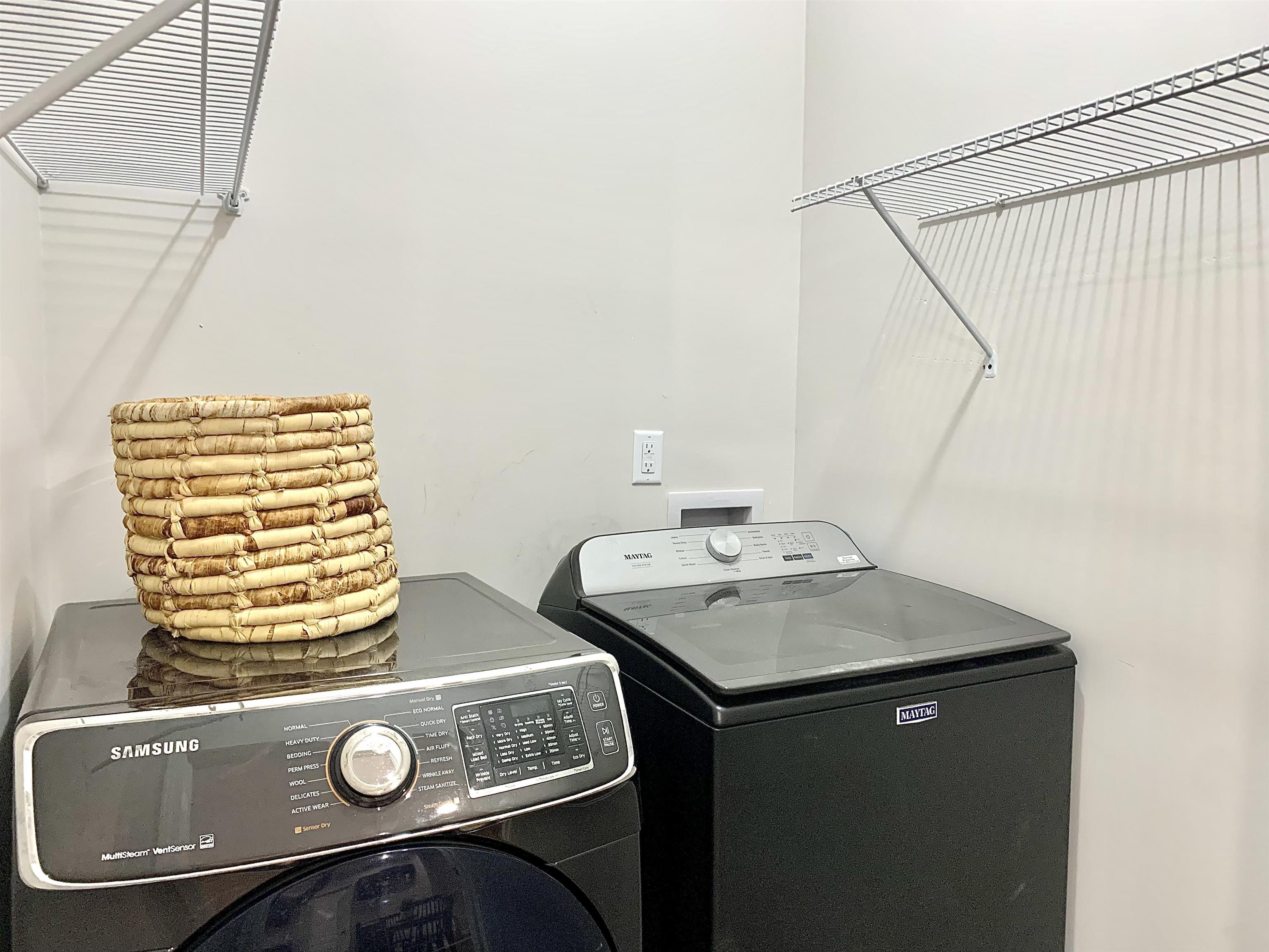 Clothes washing area with washing machine and clothes dryer