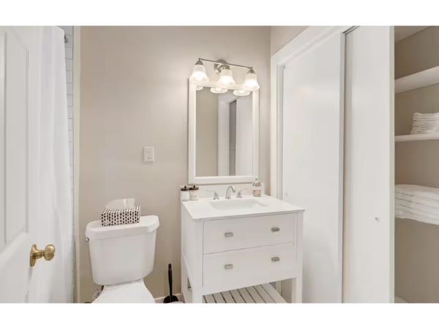 Bathroom with vanity and toilet