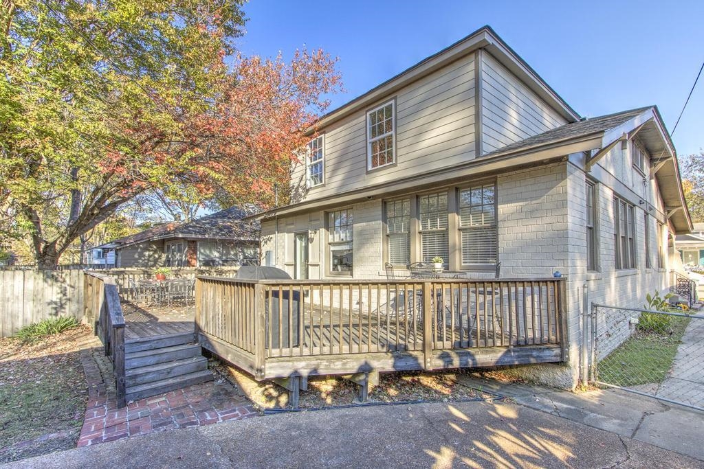 Rear view of house with a wooden deck