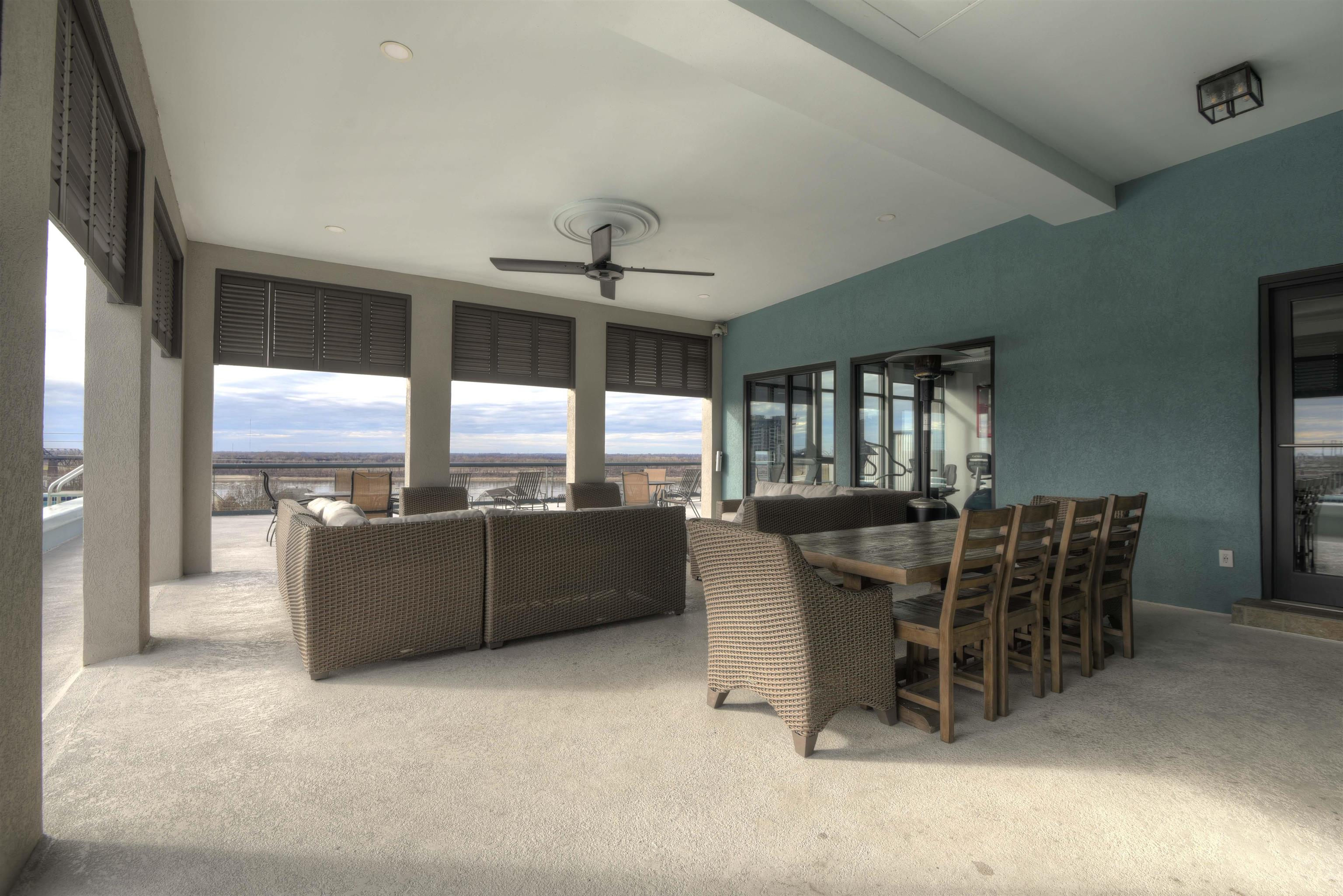 Interior space with beam ceiling and ceiling fan