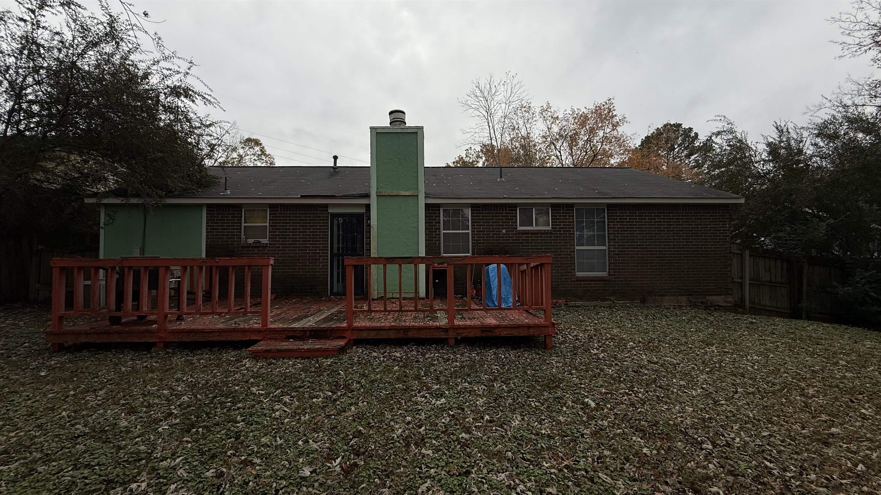 Back of house with a wooden deck