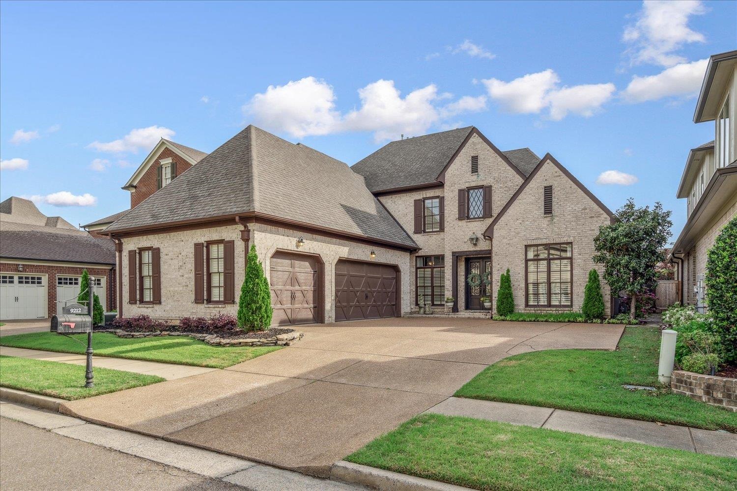 Beautifully designed home in Enclave Estates of Germantown offering a smart, spacious layout & sophisticated finishes throughout. Striking double iron entry doors set the tone for this home's style. The main level features a luxurious primary suite with spa-like bath, generous walk-in closet & direct access to the laundry room—perfect for convenience. A second ensuite bedroom is also located downstairs. The gourmet kitchen boasts a large island w/ breakfast bar, gas cooking, double ovens & a butler’s pantry—ideal for entertaining. Gorgeous real hardwood floors flow throughout the main level, adding warmth and timeless elegance. Upstairs includes two additional bedrooms, a full bath, an office nook, & a versatile bonus/media room. Enjoy quiet mornings or relaxing evenings on the screened back porch. The home also includes a spacious 3-car garage, providing plenty of room for vehicles or storage. Tall ceilings, brick flooring & charming architectural details complete this standout home.