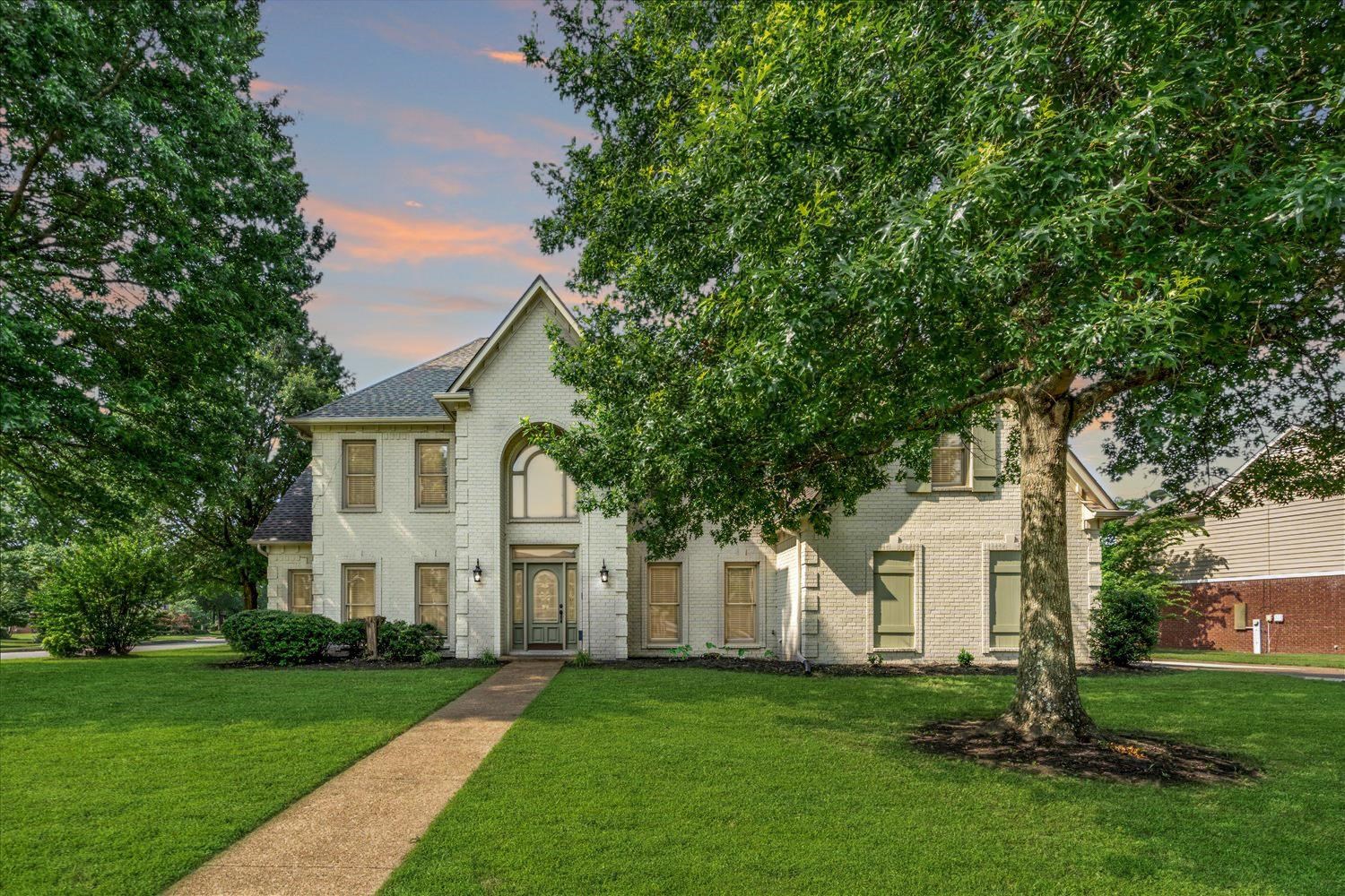 2.25% VA ASSUMABLE LOAN! In the heart of Collierville’s beloved Wellington Farms, this stunning home is the one you’ve been waiting for! Situated on a spacious corner lot, this beautifully maintained home offers 5 generously sized bedrooms (primary suite on the main level) & 3.5 bathrooms, + a large bonus & flex room/office. The open kitchen & keeping room are perfect for entertaining, featuring SS appls, double ovens, a streamlined breakfast bar, & a cozy fireplace in the den. Downstairs showcases hand-scraped hardwood floors, while new carpet adds comfort upstairs. The oversized primary suite includes a sitting area or flex space, a luxurious bath w/ dual vanities, walk-in closet, separate walk-in shower & jetted tub. Roomy laundry w/ sink + 2nd refrigerator space. Enjoy the convenience of a 3-car garage, brand new roof, & HVAC units -1 & 2 yr old, freshly painted, some newly updated windows. Step outside to relax on the back patio in your private backyard—move-in ready!