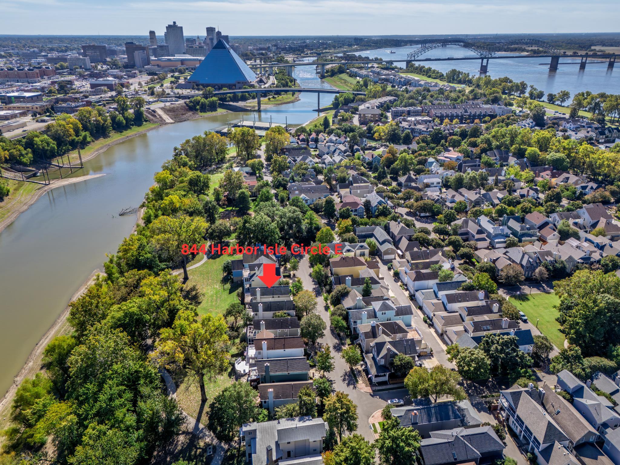 Enjoy the best of Harbor Town living in this well-appointed home overlooking the harbor. This residence features 3 spacious bedrooms and 3 full baths with an open-concept floor plan and an updated kitchen showcasing stainless steel appliances and quartz countertops. Gorgeous nail-down hardwood floors flow throughout the main living spaces. The guest bathroom downstairs has been recently remodeled with a new vanity, seamless glass shower, and attractive tile. Upstairs, both bedrooms offer privacy and comfort with their own dedicated bathrooms. The primary suite includes a private balcony with a brand- NEW deck — the perfect spot to unwind and take in the serene river views. A screened-in patio just off the living room also overlooks the water, providing a peaceful outdoor retreat. Refrigerator, washer, and dryer convey with the home — move right in and start enjoying the view!