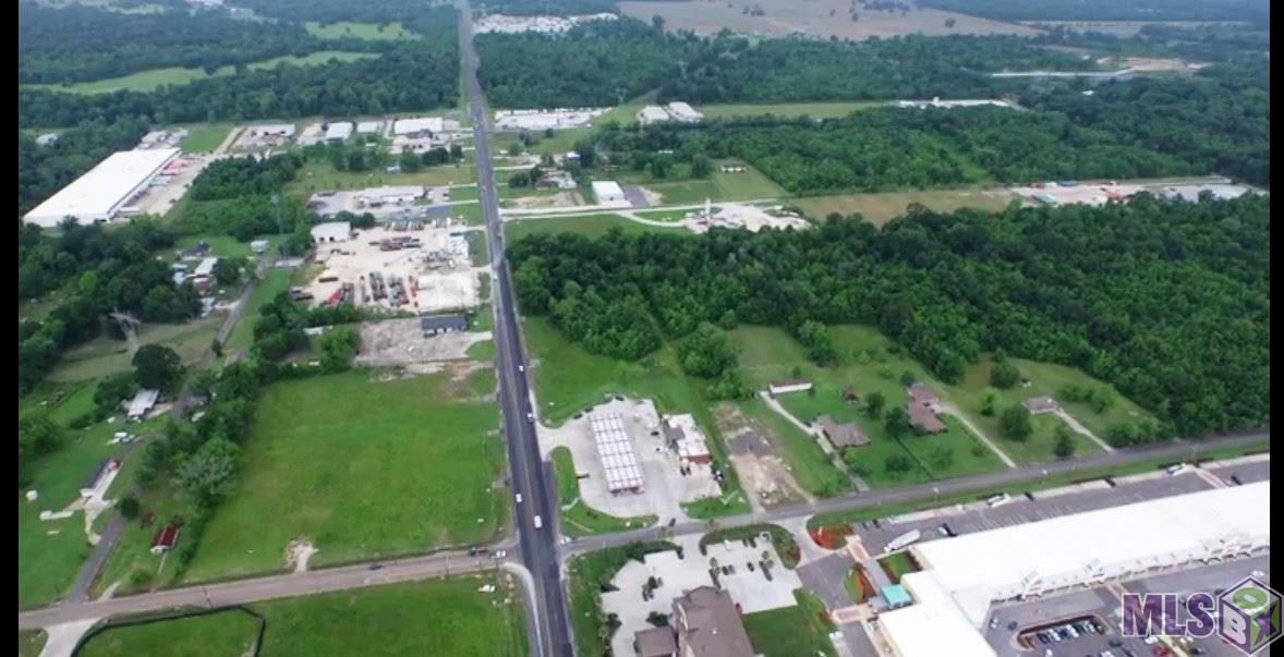 Prime commercial location site. 1.821 acre parcel is zoned C-1 by City of Gonzales. Property is visible from I-10 exit on the Baton Rouge/New Orleans corridor. Located immediately west of the RaceTrac convenience store/gas station and the new Holiday Inn Express, near a high traffic corner on LA Hwy 30 that serves as entrance road to Lamar/Dixon Expo Center. Located 1,300 feet from entrance to Tanger Mall and near Cabelas commercial development, Sportman's Park. Utilities including municipal water and sewage available for this lot. Ready for your development.