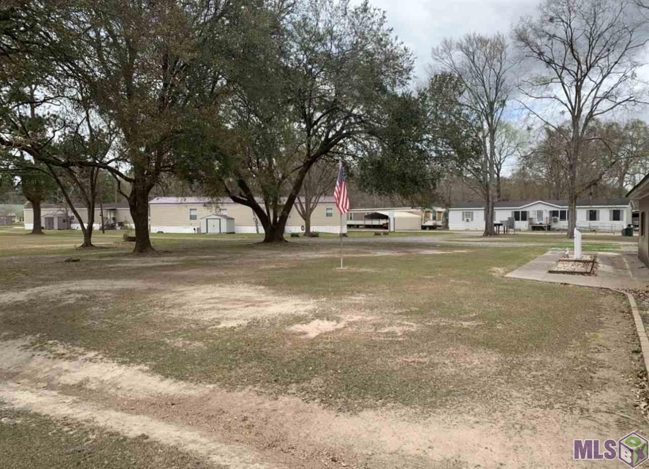GREAT INVESTMENT OPPORTUNITY!! Active 33 Spot occupied trailer park with 2800 sqft home at the front. Park managed with long term tenants. Spot only rent no park owned trailers to worry about. 29 spots rented at $250/month below market rents. 3 abandoned spots ready for move in. Home currently used for park manager storage but could be updated and rented!